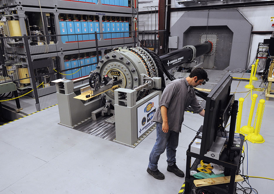 Dan Wise, from Naval Surface Warfare Center, Dahlgren Division, prepares to take readings following successful test of Office of Naval Research–funded Electromagnetic Railgun, in Virginia, June 21, 2012 (U.S. Navy/John F. Williams)