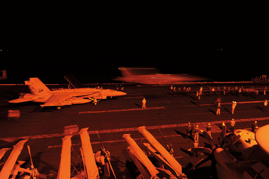 F/A-18E Super Hornet, attached to Strike Fighter Squadron 31, and F/A-18F Super Hornet, attached to Strike Fighter Squadron 213, prepare to launch from flight deck of USS George H.W. Bush to conduct strike missions against ISIL targets, September 2014 (U.S. Navy/Robert Burck)