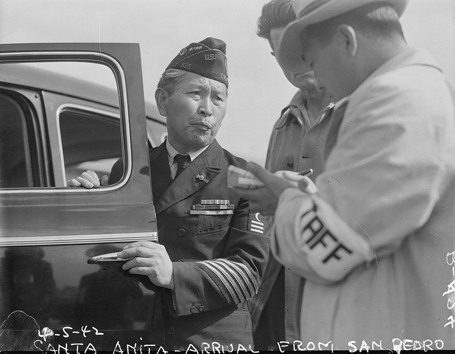 Dressed in uniform marking service in World War I, this veteran enters Santa Anita assembly center for persons of Japanese ancestry evacuated from West Coast, April 5, 1942, Arcadia, California (National Archives and Records Administration/Clem Albers)