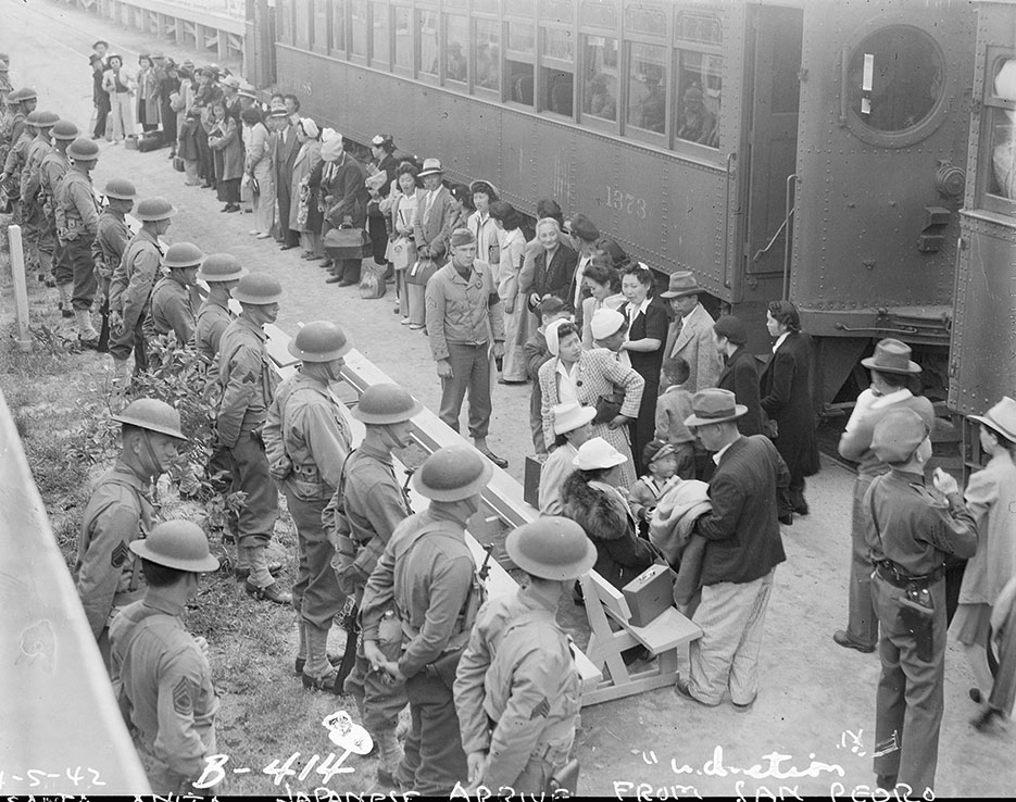 Persons of Japanese ancestry arrive at Santa Anita Assembly center from San Pedro, California, April 5, 1942, Arcadia, California (National Archives and Records Administration/Clem Albers)