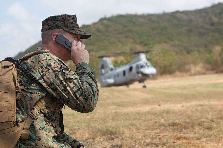 Air traffic controller with 31st Marine Expeditionary Unit communicates with pilot of CH-46E Sea Knight helicopter with Marine Medium Helicopter Squadron 262 (Reinforced), 31st MEU, during multilateral NEO exercise, February 12, 2011 (DOD)