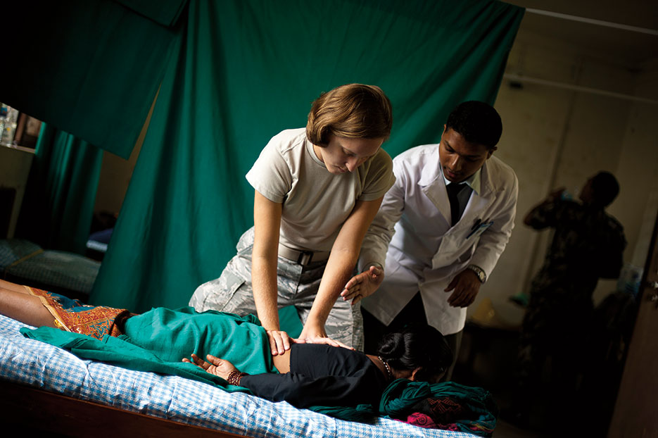 Airman treats patient during U.S. Pacific Command’s Operation Pacific Angel 12-4 in Nepal, on September 11, 2012 (U.S. Air Force/Jeffrey Allen)