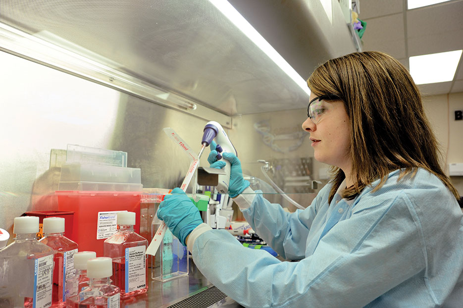 Army microbiologist on Edgewood Chemical Biological Center in vitro research team conducts laboratory research (U.S. Army/Conrad Johnson)