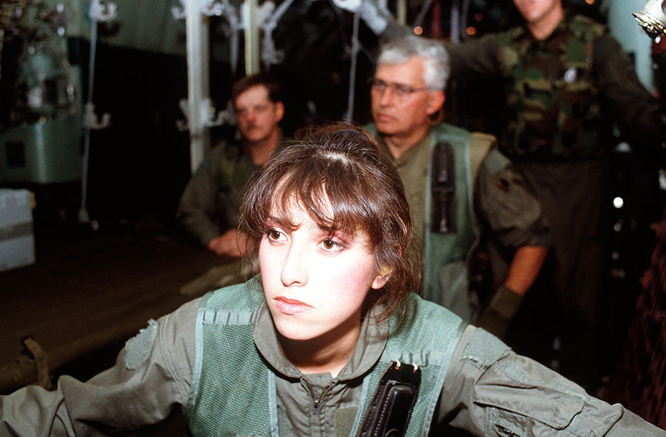 Airman, front, of 68th Aeromedical Evacuation Squadron (AES), Norton Air Force Base, Airman, right, of 118th AES, Tennessee Air National Guard, and Airman, left, of 137th AES receive mission briefing during Operation Desert Storm (U.S. Air Force/Kimberly Yearyean)