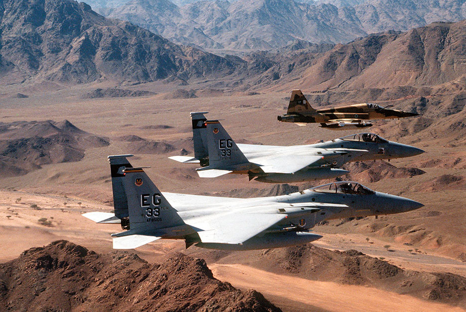 Air-to-air view of two U.S. Air Force F-15C Eagle fighter aircraft of 33rd Tactical Fighter Wing, Eglin Air Force Base, and Royal Saudi air force F-5E Tiger II fighter aircraft during mission in support of Operation Desert Storm (U.S. Air Force/Chris Putman)