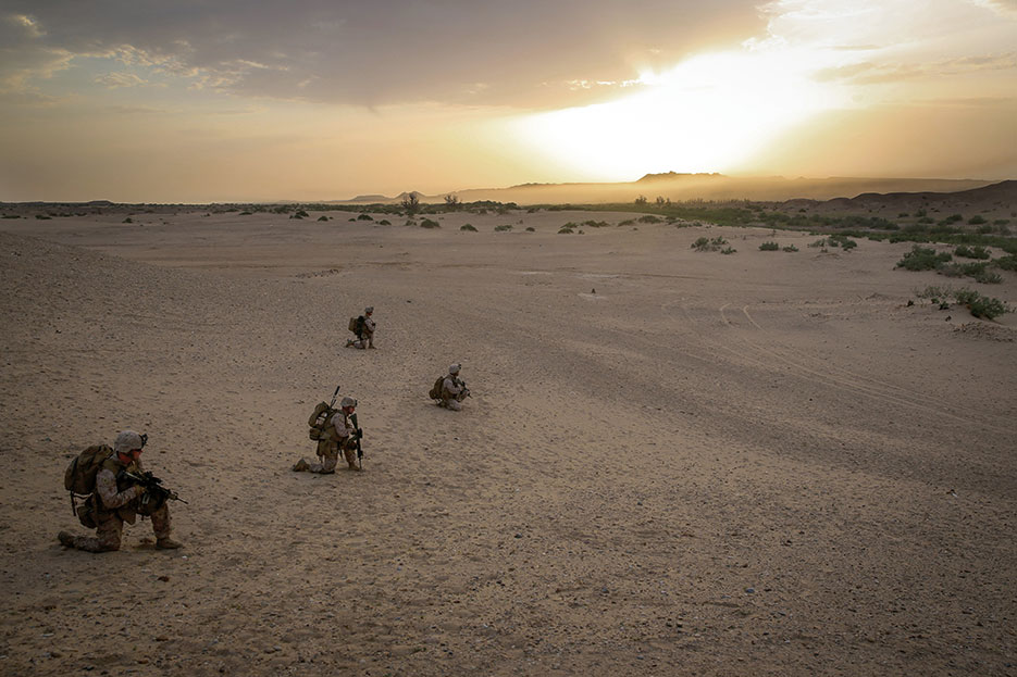 Marines with Bravo Company, 1st Battalion, 7th Marine Regiment, provide outboard security after offloading from CH-53E Super Stallion helicopter during mission in Helmand Province, May 1, 2014 (U.S. Marine Corps/Joseph Scanlan)