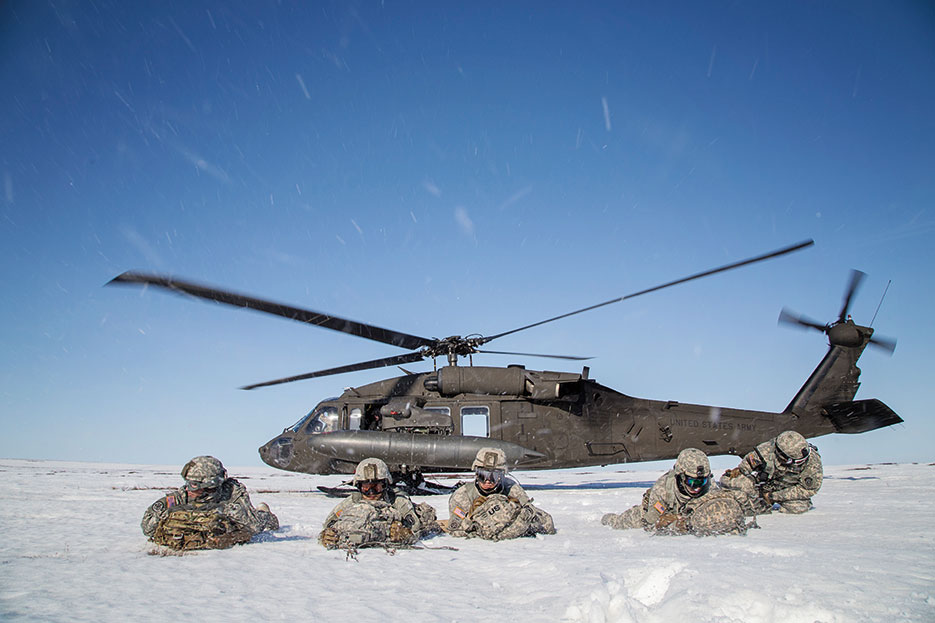 Paratroopers with 6th Engineer Battalion, 2nd Engineer Brigade, pull security after exiting UH-60 Black Hawk during exercise Arctic Pegasus near Deadhorse, Alaska, May 2, 2014 (DOD/Edward Eagerton)