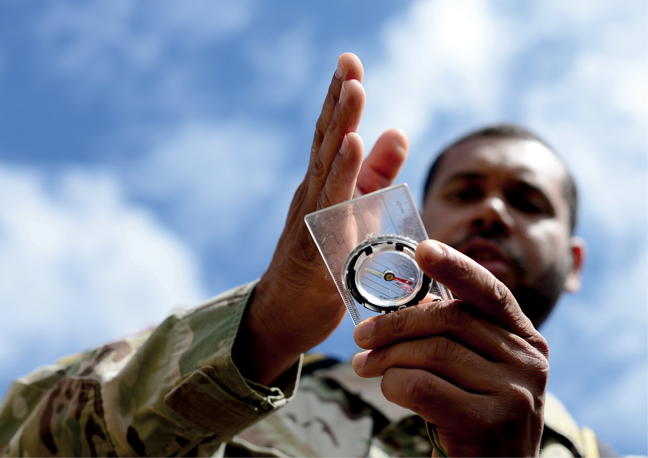 U.S. Air Force survival evasion resistance and escape specialist air advisor, with 818th Mobility Support Advisory Squadron, demonstrates navigation skills for Kenyan Defense Force members, Laikipia Air Base, Kenya, June 23, 2016 (U.S. Air Force/Evelyn Chavez)