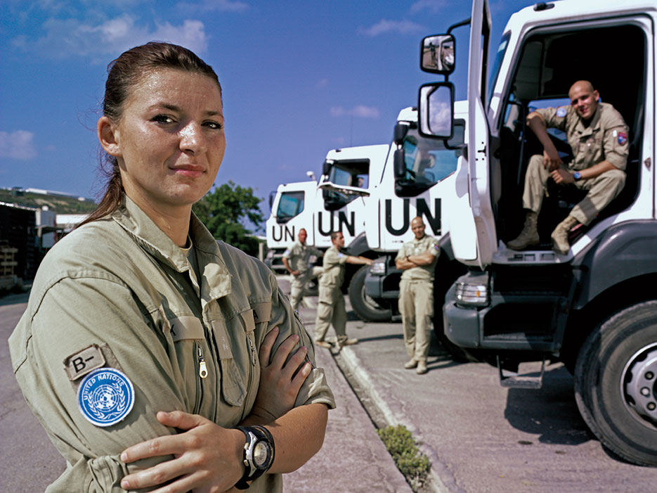 Master Corporal Larissa Pollak, Austrian Contingent, which is in charge of transport operations in United Nations Interim Force in Lebanon, with teammates at headquarters, Naqoura, Lebanon, September 2012 (United Nations)