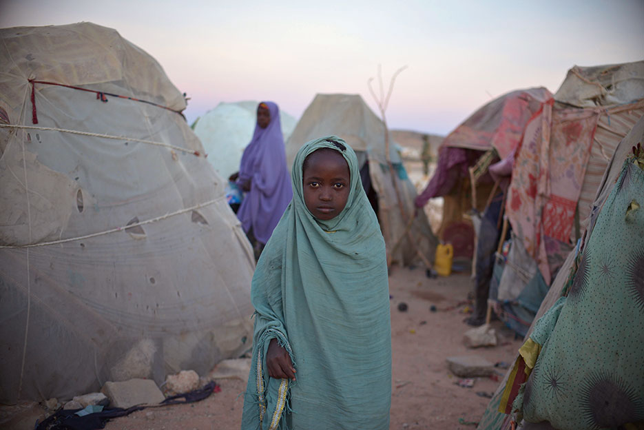 Girl stands on outskirts of camp for internally diplaced persons outside of Belet Weyne, Somalia (United Nations/Tobin Jones)