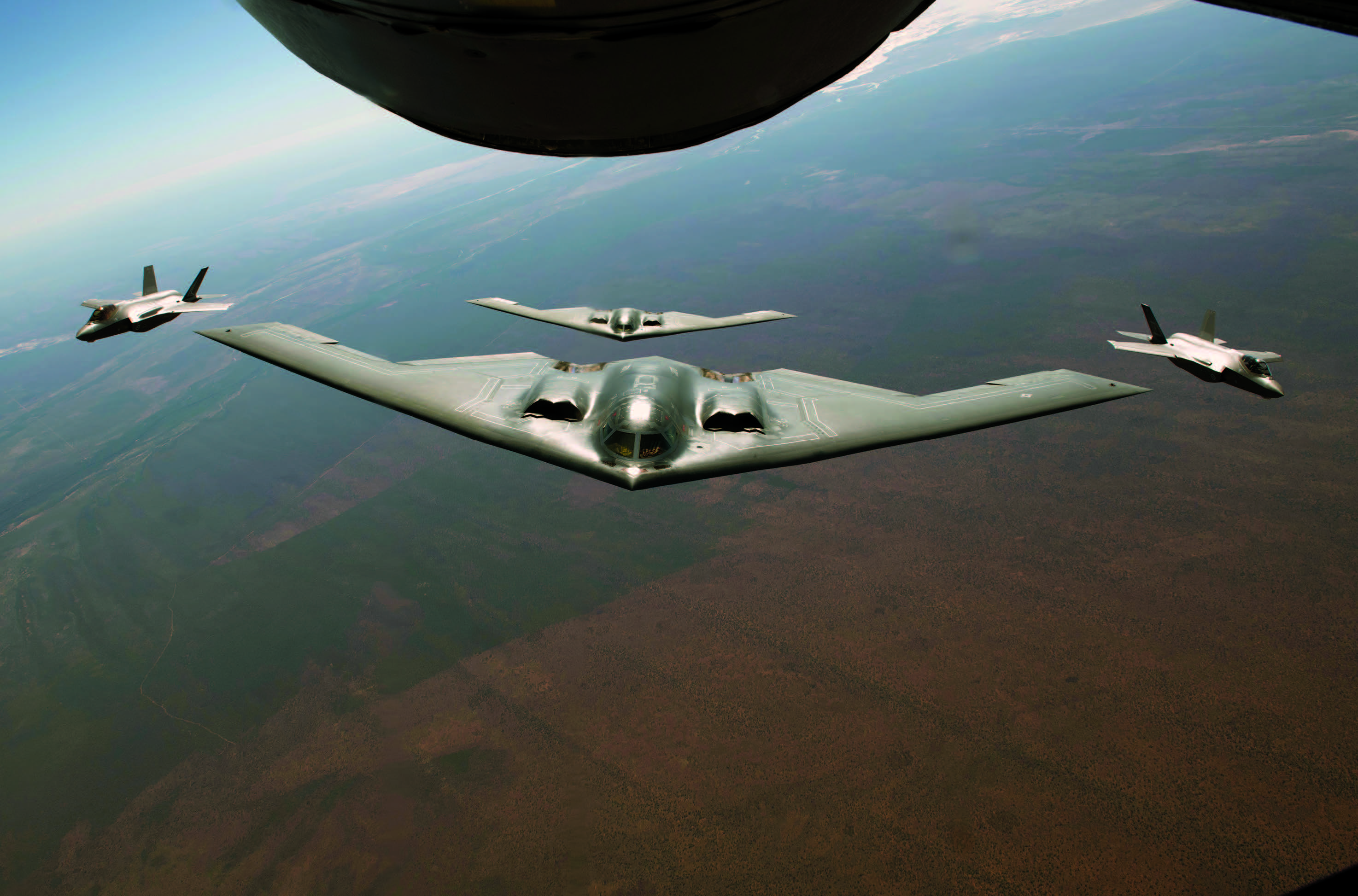 Two U.S. Air Force B-2 Spirits assigned to 509th Bomb Wing, Whiteman Air Force Base, Missouri, fly Bomber Task Force mission alongside two Royal Australian Air Force F-35A Lightning IIs during exercise Koolendong 22 over Royal Australia Air Force Base Curtin, Australia, July 18, 2022 (U.S. Air Force/Dylan Nuckolls)
