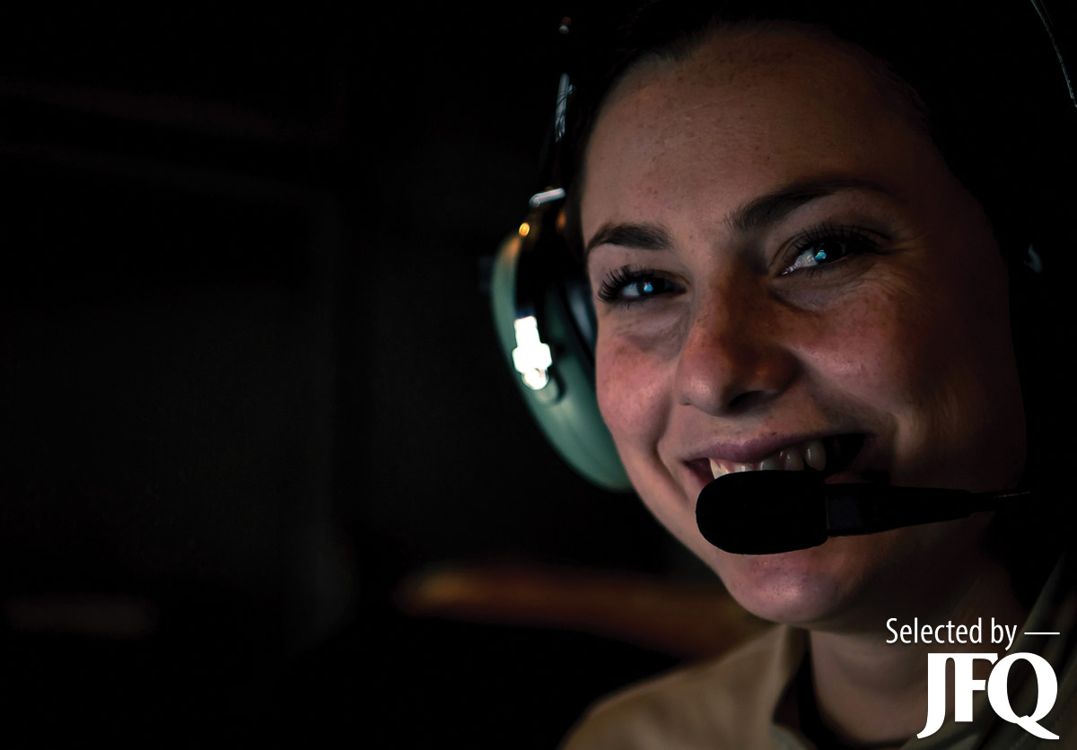 Air Force KC-10 Extender inflight refueling specialist reacts to communication among aircrew during air refueling mission