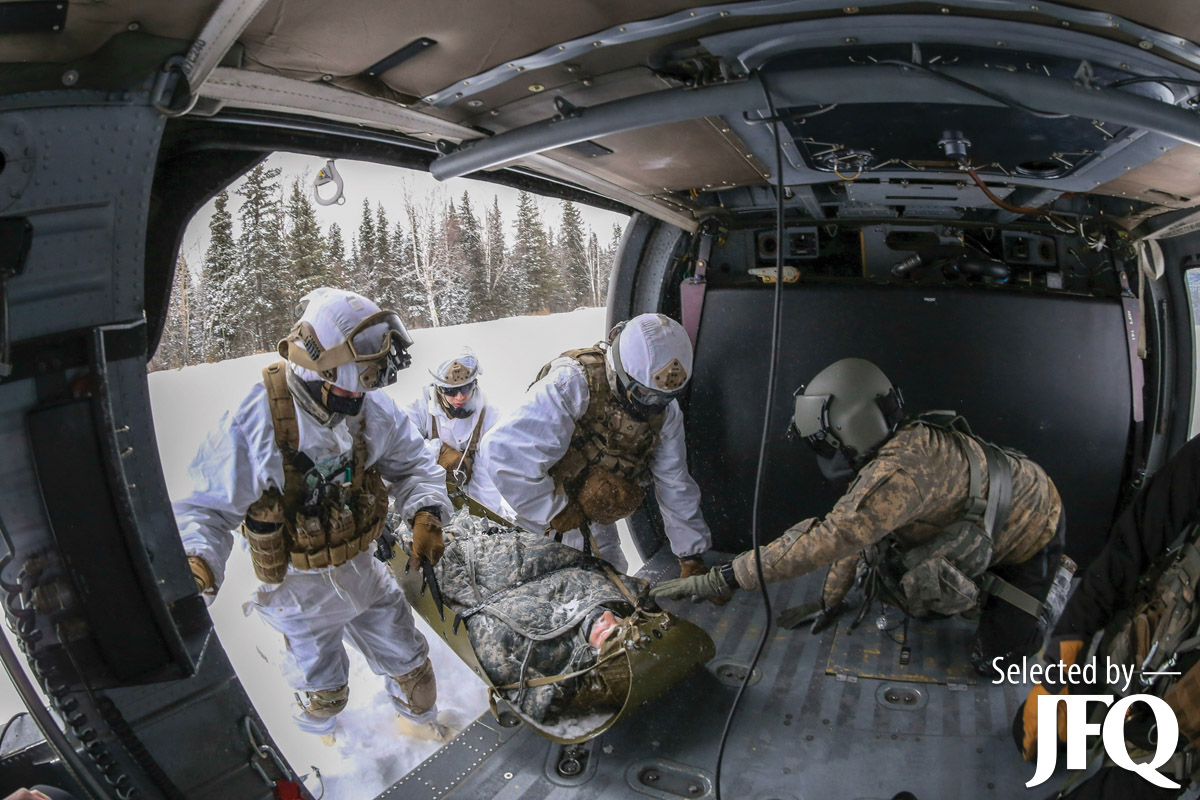 Alaska Army Guardsmen rehearse medical evacuation procedures with Army Alaska paratroopers during medical evacuation and hoist familiarization training