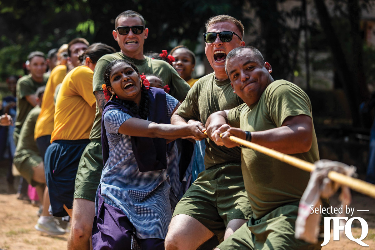 U.S. Marines and Sailors play tug-of-war with members of Visakhapatnam Government Home for Girls