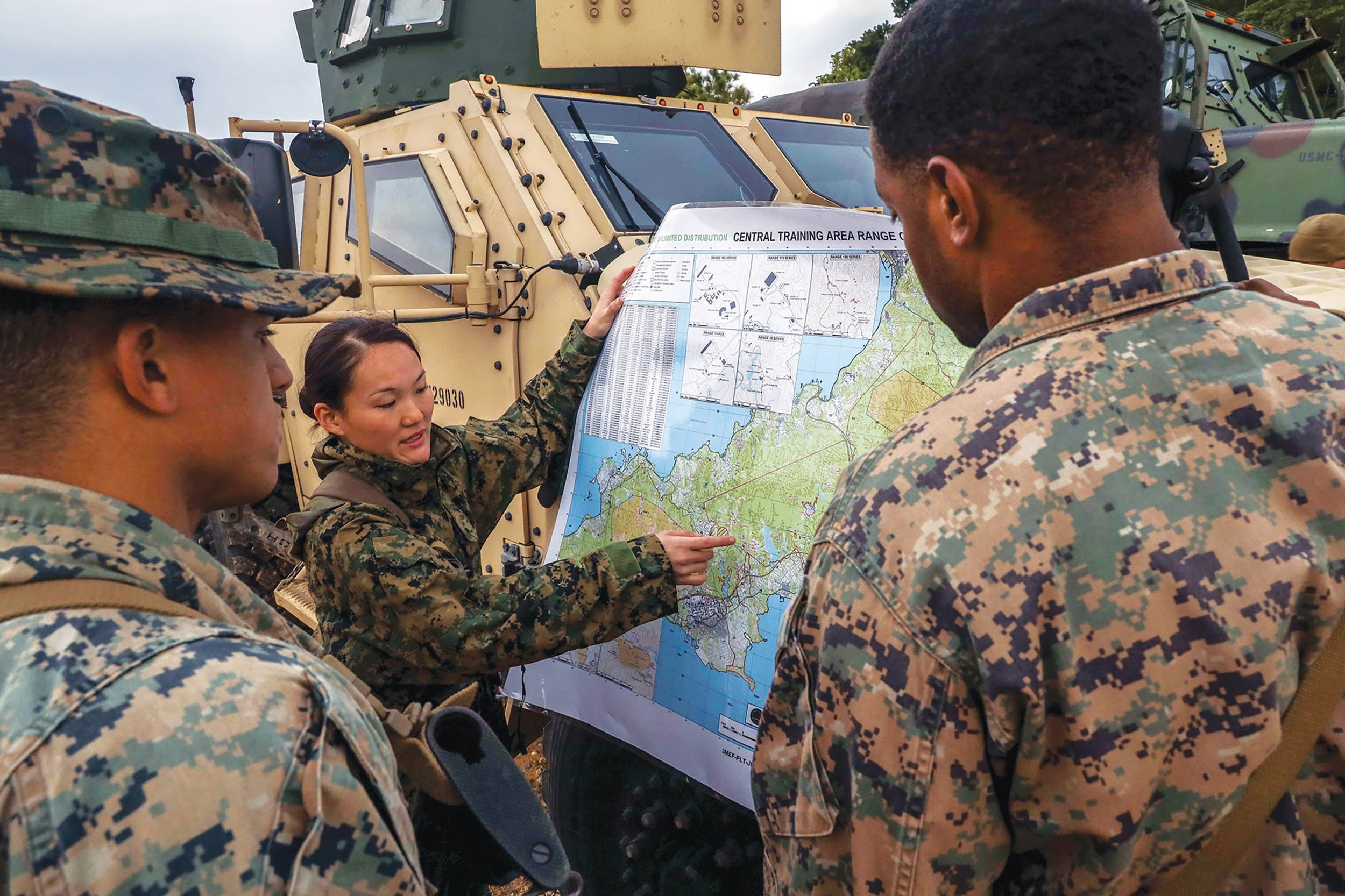 Marine Corps platoon commander with Combat Logistics Company Alpha discusses plan during Jungle Warfare Exercise 22