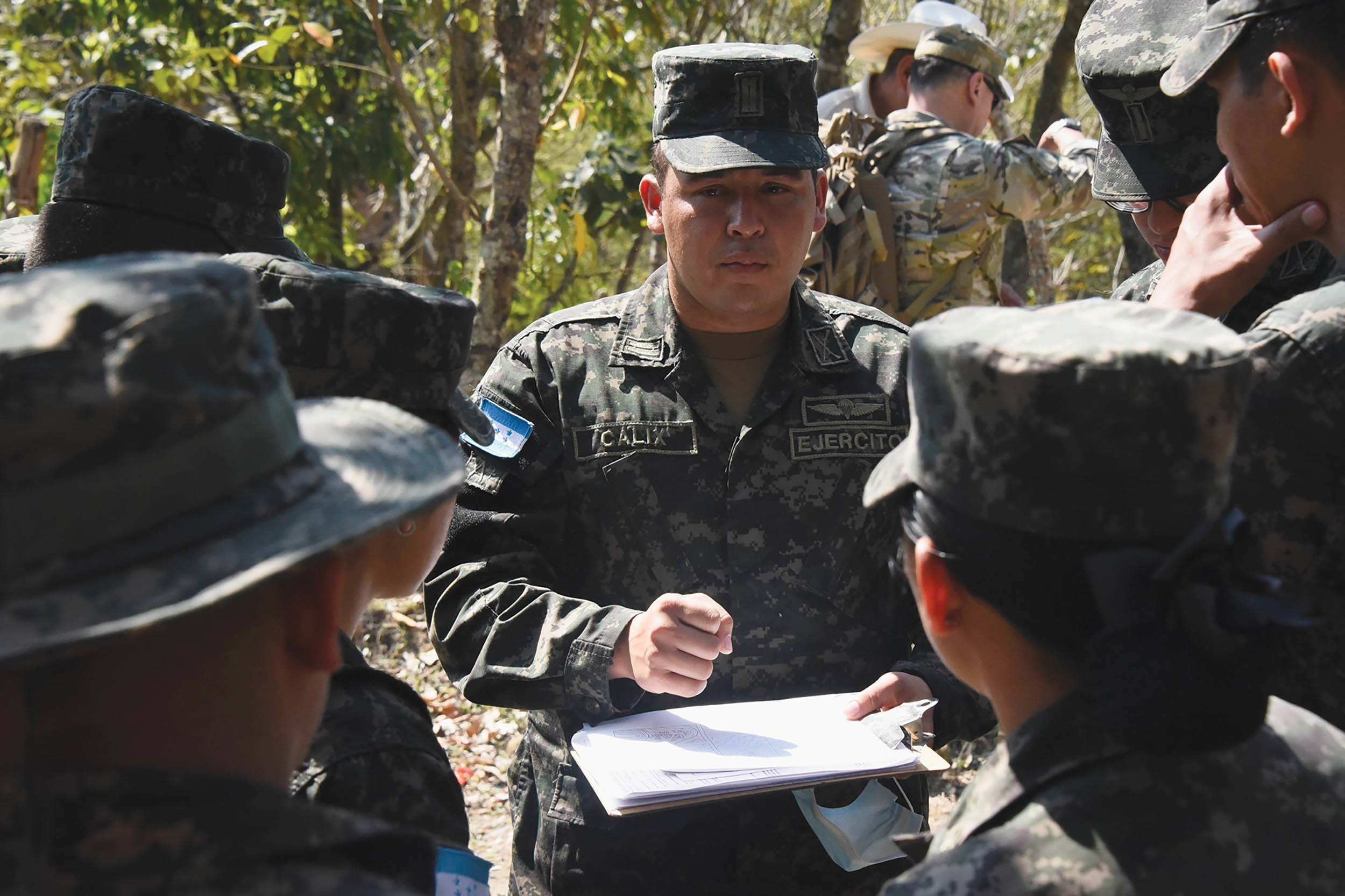 Honduran army Lieutenant prepares his team to conduct site assessment at Ostuman during cultural heritage protection exchange with U.S. military experts
