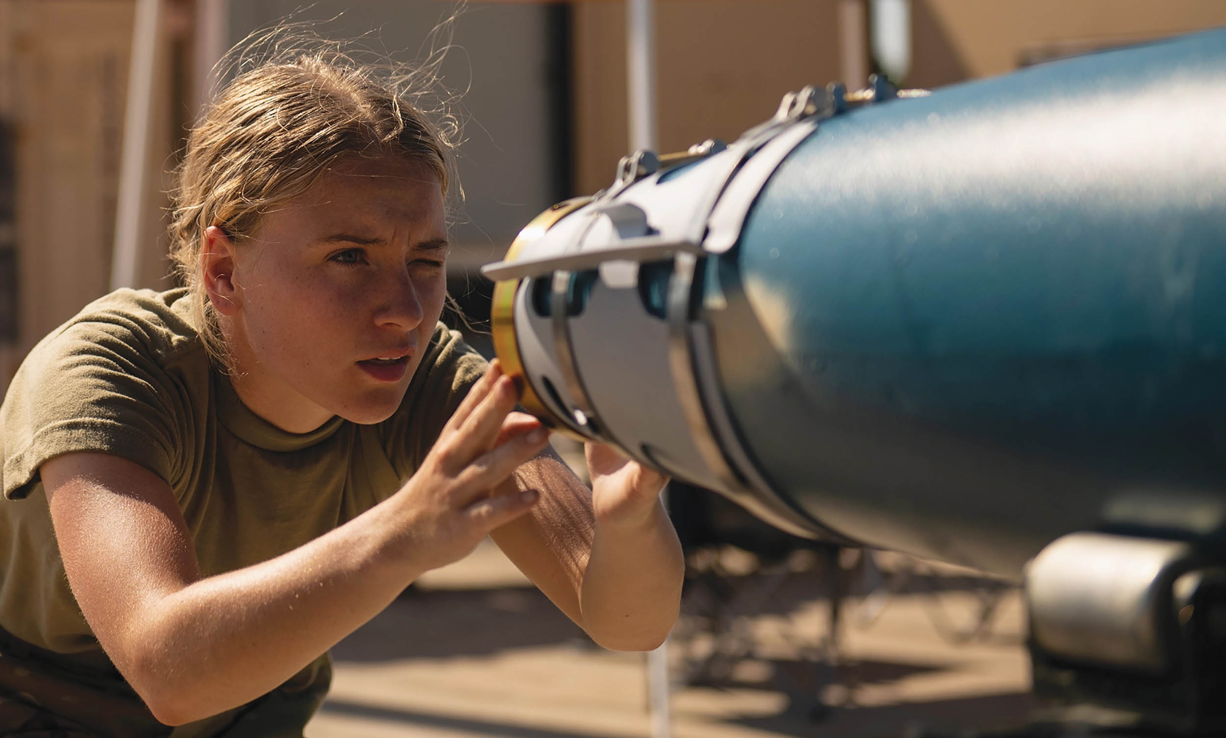 Air Force Senior Airman builds GBU-38 joint direct attack munitions during large-scale readiness exercise