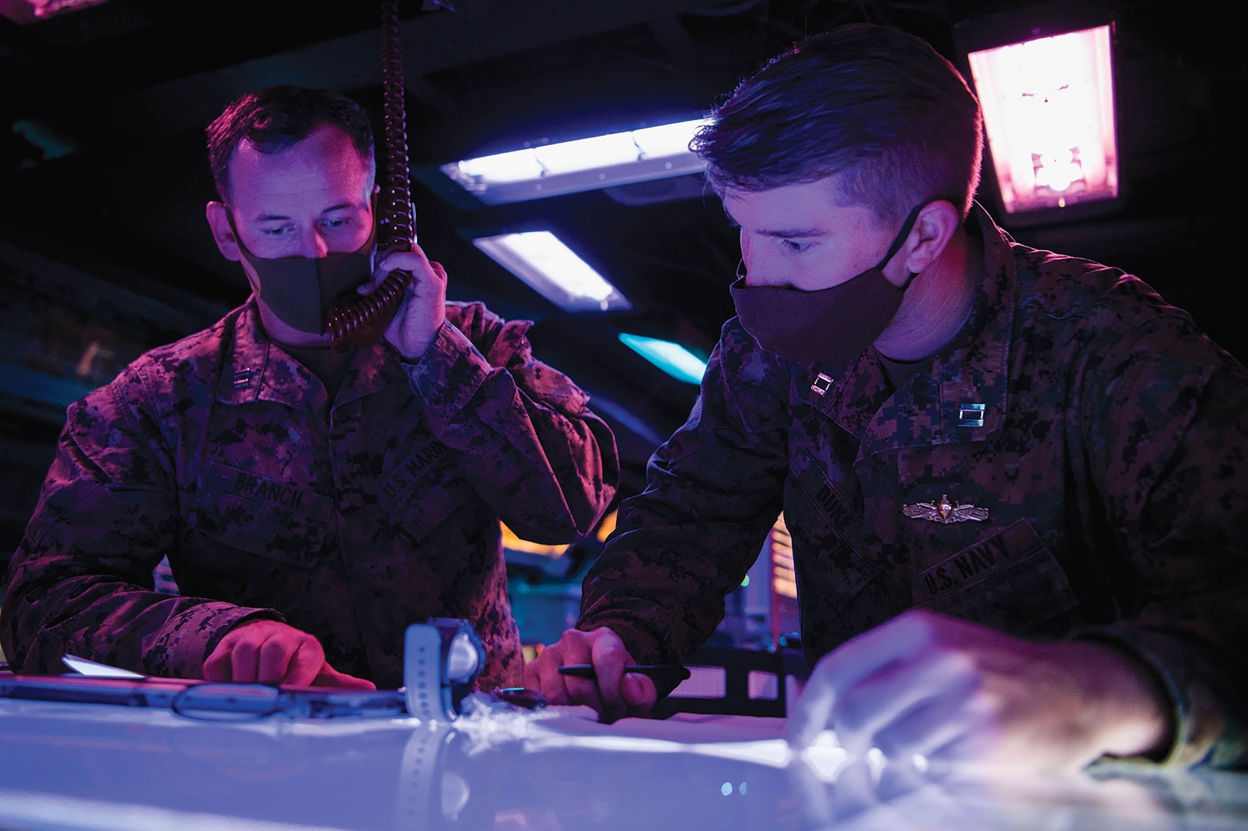 Marine and Navy Lieutenant conduct Naval Surface Fire Support communication drills with Japanese Ground Self-Defense Force in Combat Information Center