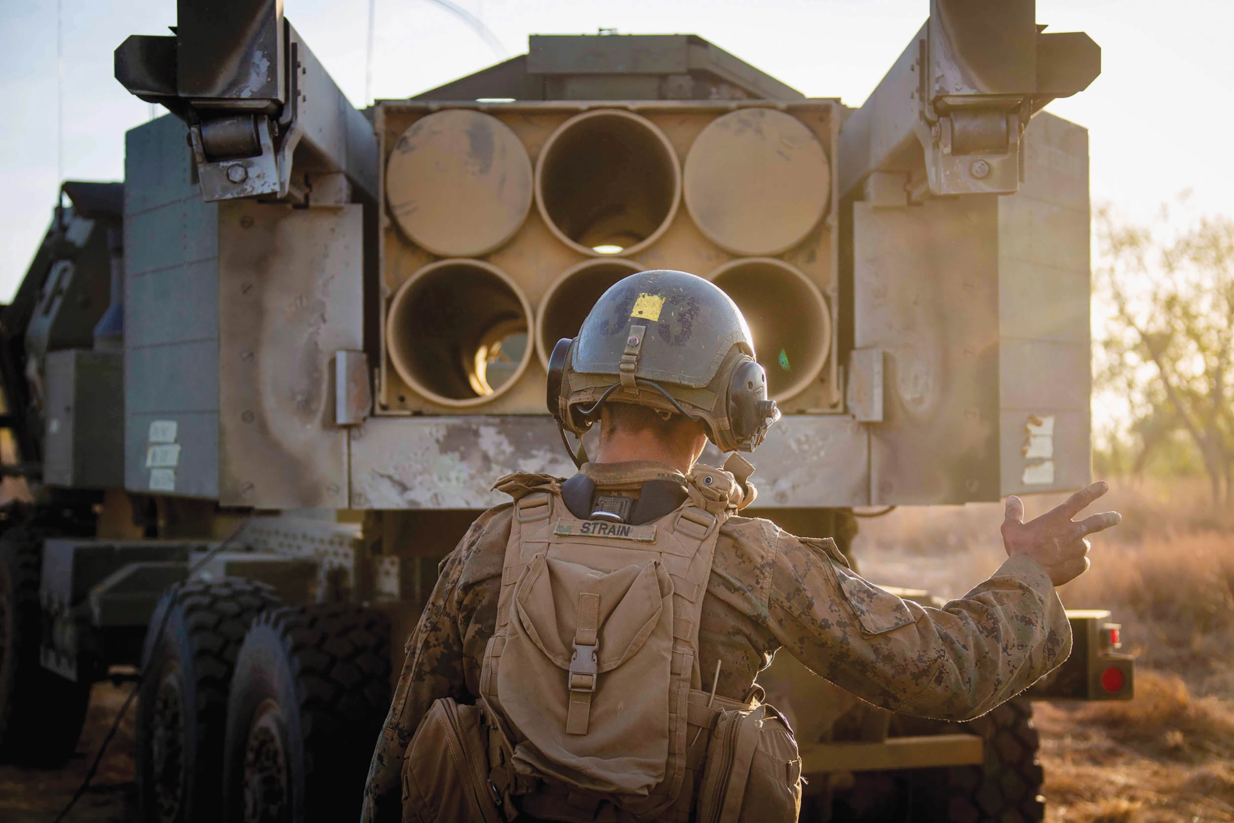 High Mobility Artillery Rocket Systems launcher chief loads Guided Multiple Launch Rocket System into launcher before emergency fire mission during Exercise Koolendong