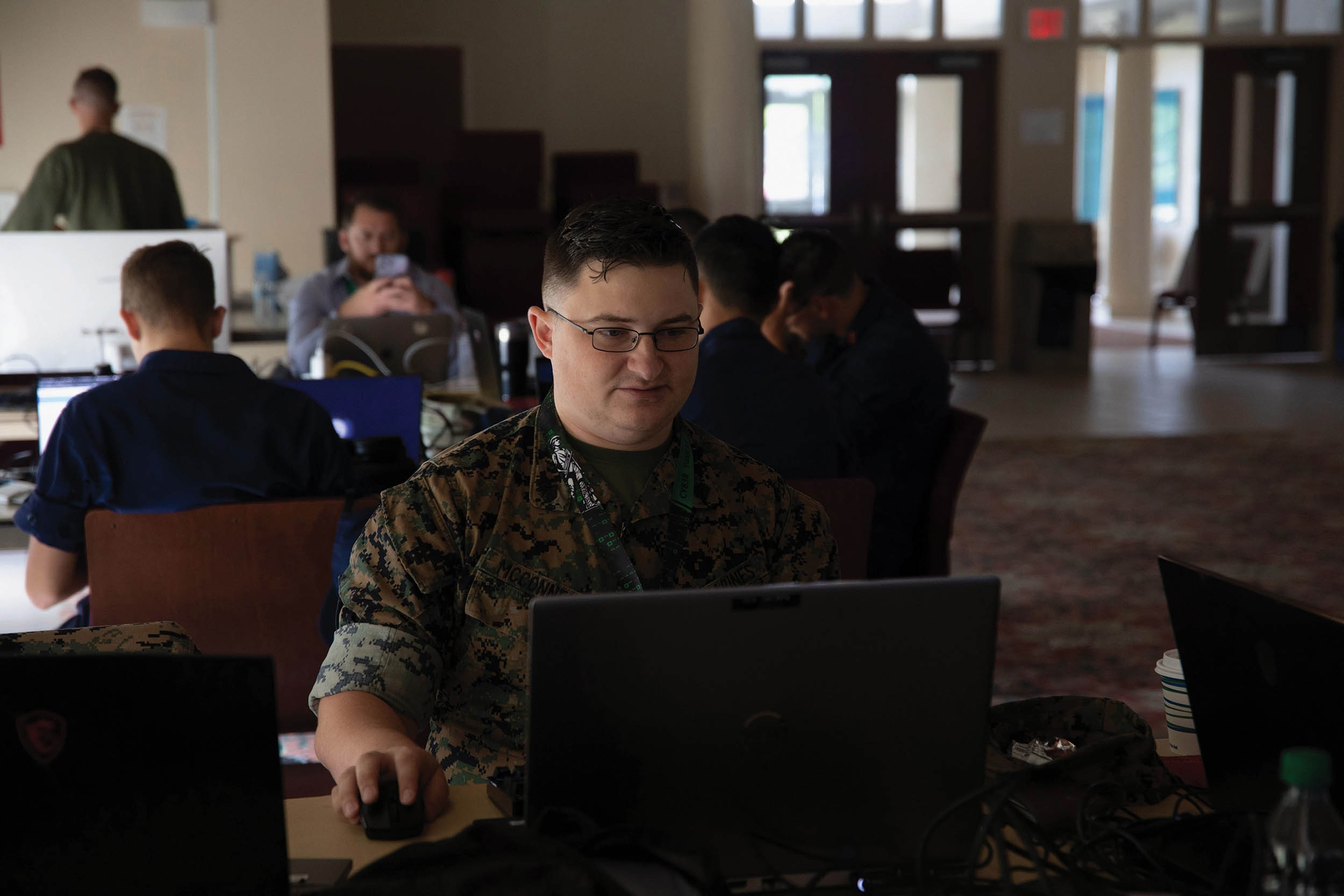 Sergeant Ian McConnell, cyber warfare operator for Defensive Cyberspace Operations–Internal Defensive Measures, 8th Communication Battalion, works on his network hacking plans during Cyber Yankee 22, on Camp Nett, Niantic, Connecticut, June 13, 2022 (U.S. Marine Corps/Ashley Corbo)