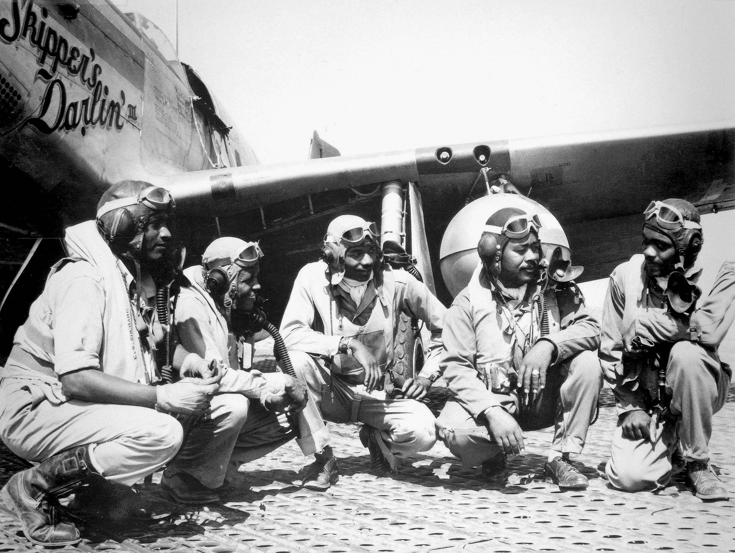 Pilots of elite, all-Black 332nd Fighter Group, “Tuskegee Airmen,” at Ramitelli, Italy; left to right, Lieutenant Dempsey W. Morgan, Lieutenant Carroll S. Woods, Lieutenant Robert H. Nelson, Jr., Captain Andrew D. Turner, and Lieutenant Clarence P. Lester, August 1944 (U.S. Air Force)
