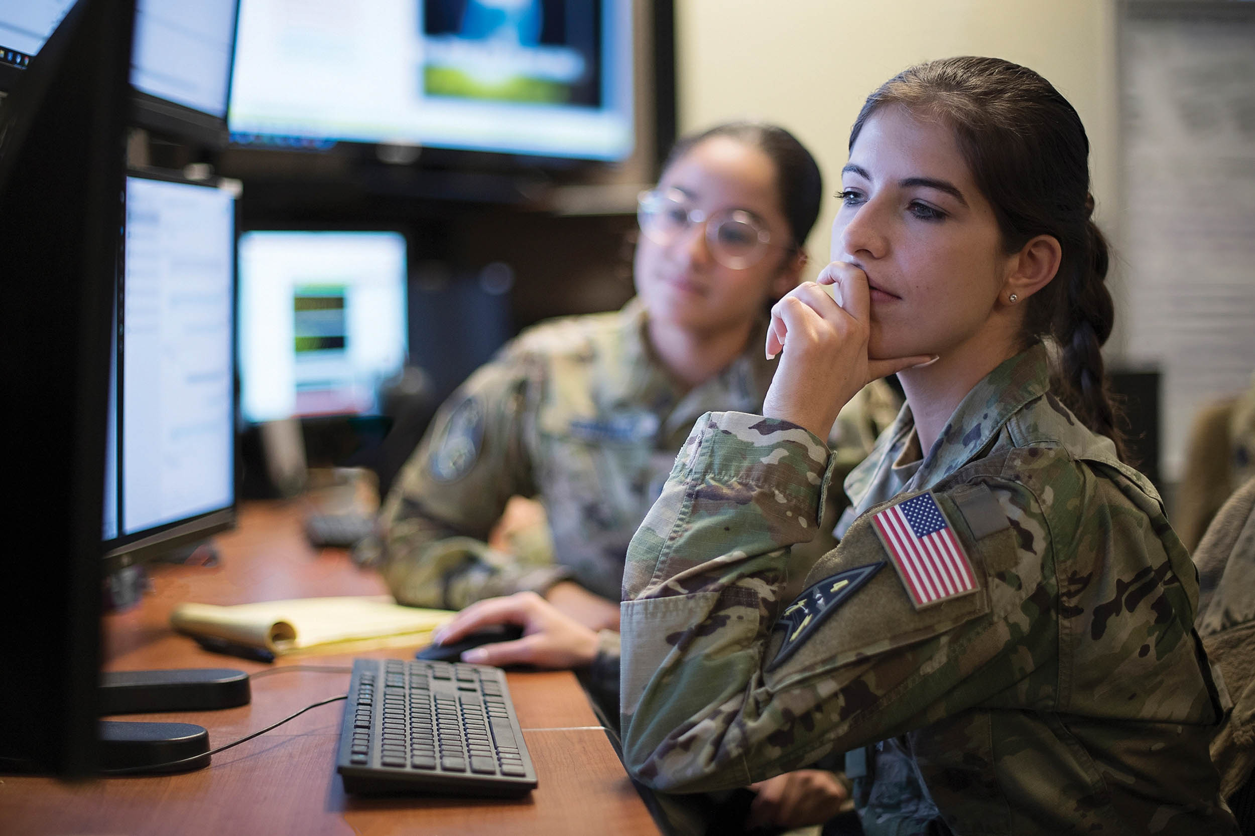 U.S. Space Force 1st Lieutenant Laura Drapinski, 2nd Space Warning Squadron, front, and Specialist 4 Ariana Gonzalez, 11th Space Warning Squadron, use Space-Based Infrared System Simulator to monitor missile indications during simulated combat operations in U.S. European Command during Space Flag 23-1, at Schriever Space Force Base, Colorado, December 13, 2022 (U.S. Space Force/Judi Tomich)
