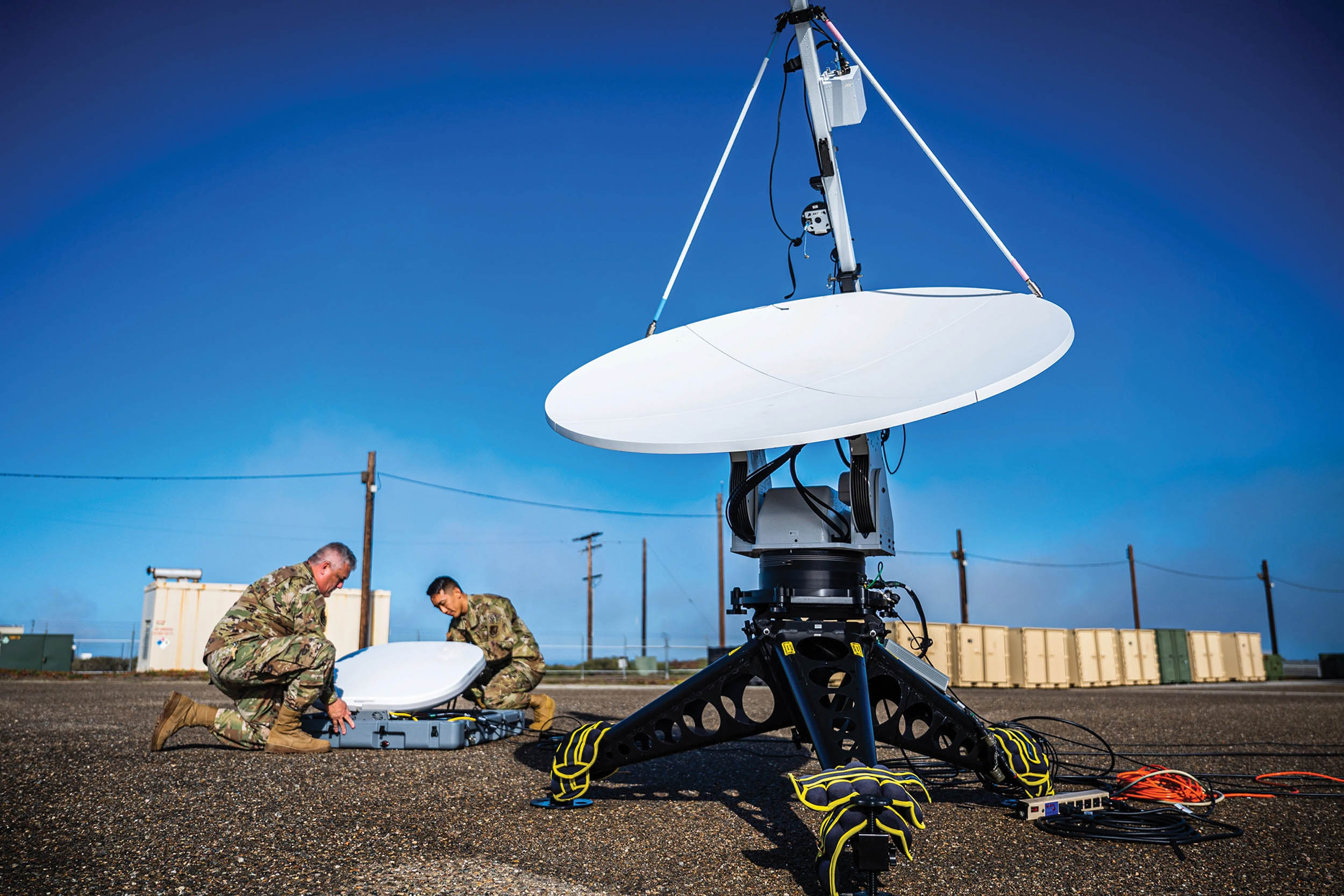 Two members of 216th Space Control Squadron set up antennas as part of “Honey Badger System” during Black Skies 22, designed to rehearse command and control of multiple joint electronic warfare fires, at Vandenberg Space Force Base, California, September 20, 2022 (U.S. Space Force/Luke Kitterman)