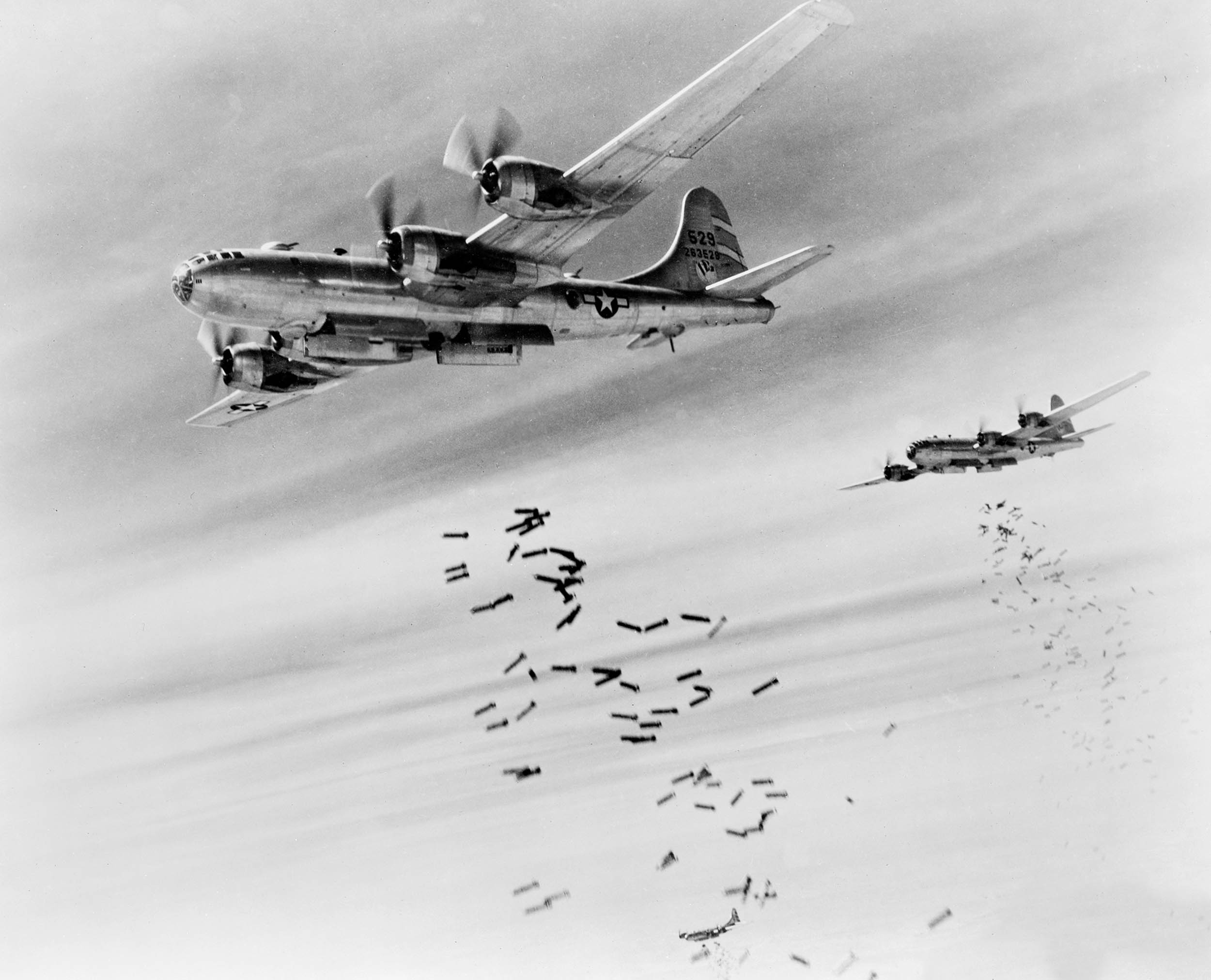 Bombs cascade from bomb bay doors of B-29 Superfortresseses during raid on Japanese supply depots near Mingaladon Airfield, February 28, 1945 (U.S. Army Signal Corps/Library of Congress)