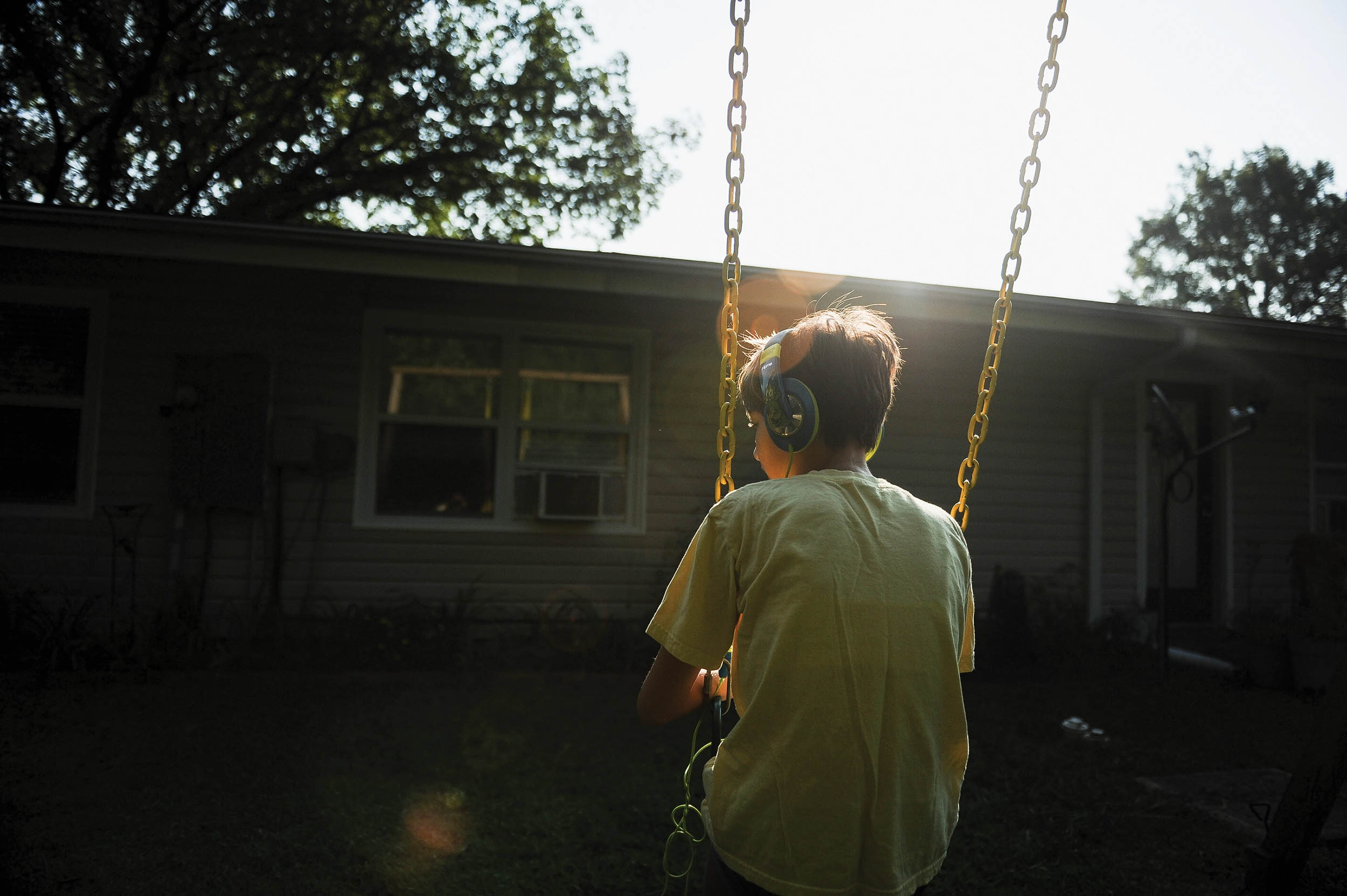 Morgan Jungk, daughter of Master Sergeant Beth Jungk, 19th Communications Squadron plans and programs manager, has autism and other complex needs as she swings in her backyard on August 24, 2013, in Jacksonville, Arkansas (U.S. Air Force/Jake Barreiro)