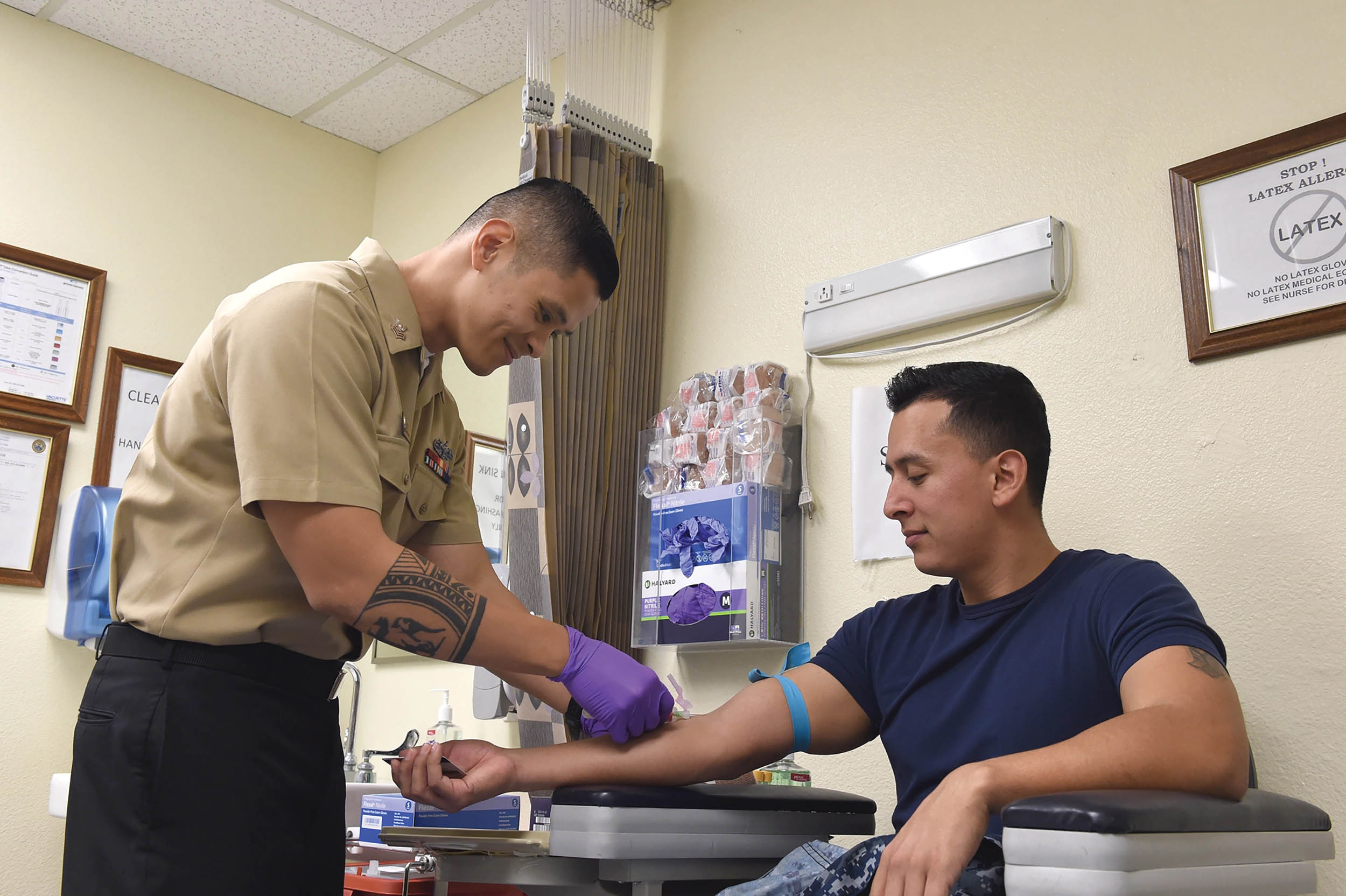 Hospital Corpsman 1st Class Oliver Arceo draws blood for Sailor’s annual HIV test at North Island Medical Clinic, Naval Air Station North Island, Coronado, California, January 7, 2017 (U.S. Navy/Marie A. Montez)