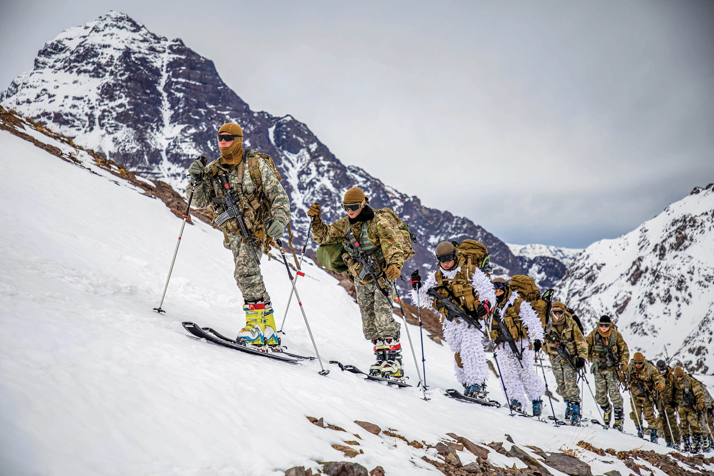 U.S. Army Soldiers assigned to Bravo Company, 2nd Battalion, 87th Infantry Regiment, 2nd Brigade Combat Team, 10th Mountain Division, and Chilean army soldiers assigned to 3rd Mountain Division, cross-country ski at Chilean Army Mountain School in Portillo, Chile, August 27, 2021 (U.S. Army/Joshua Taeckens)