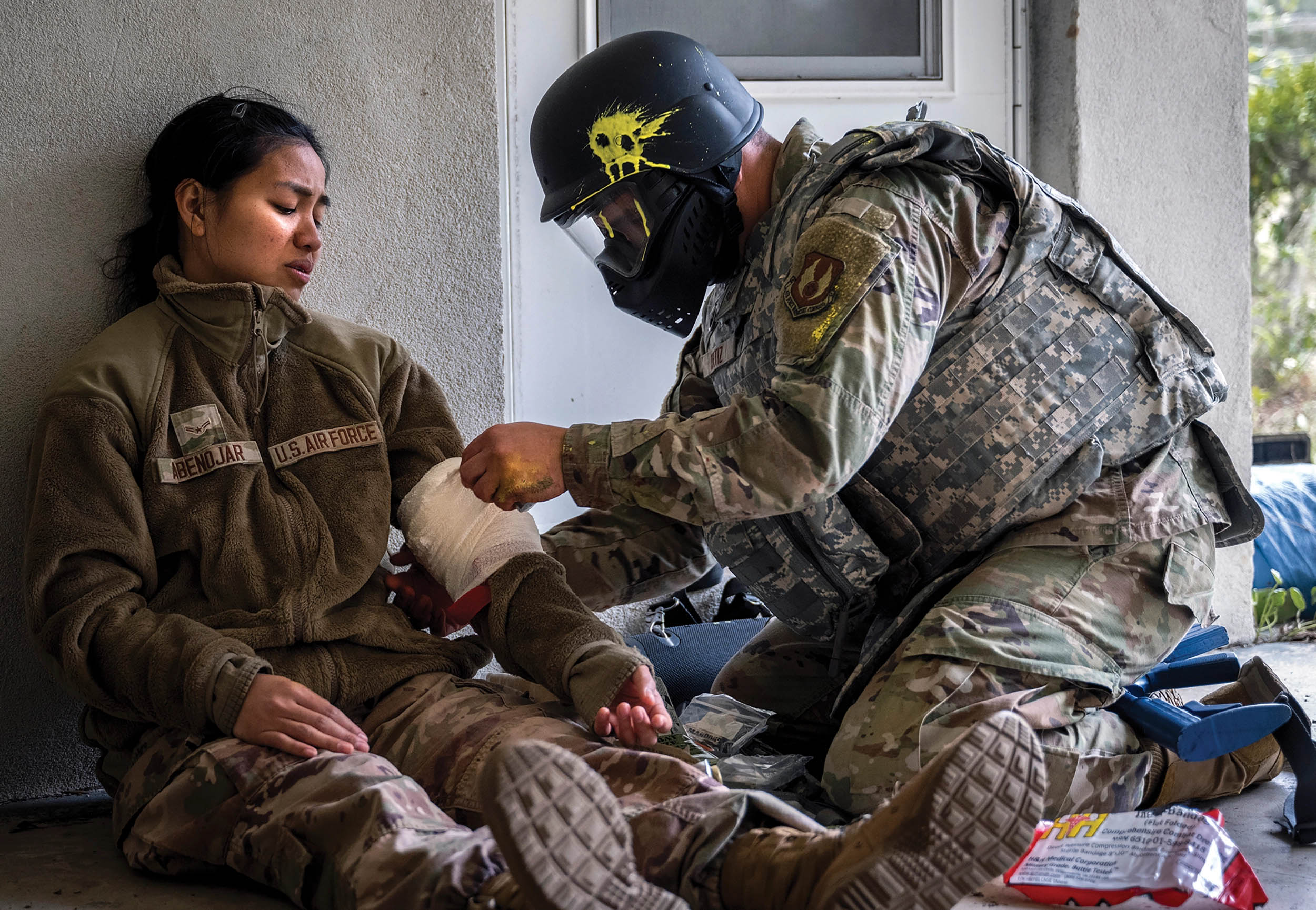Airman with 96th Medical Group provides aid to simulated victim during scenario for Tactical Combat Casualty Care training, November 17, 2022, at Eglin Air Force Base, Florida (U.S. Air Force/Samuel King, Jr.)