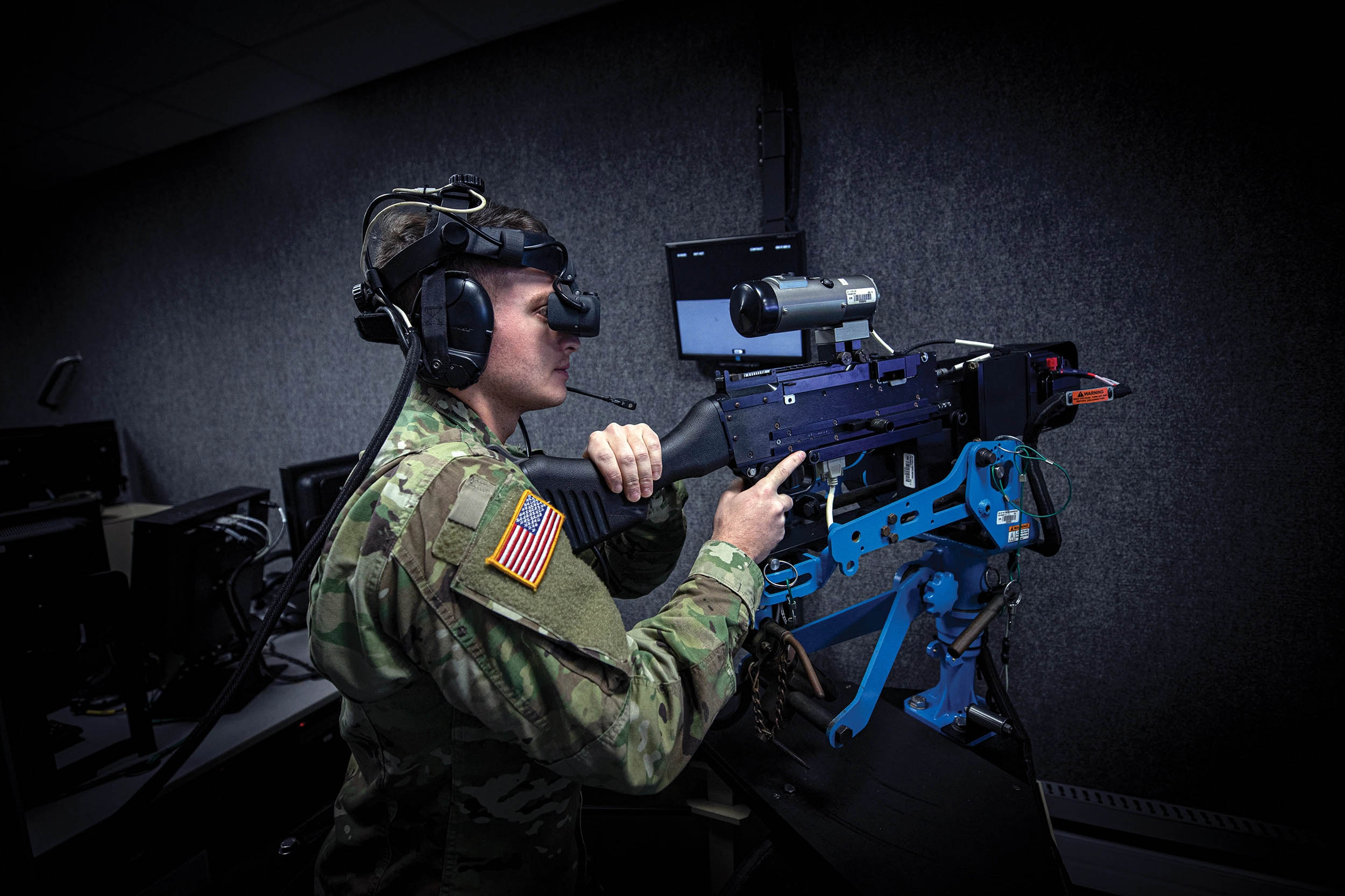Army Soldier with New Jersey National Guard’s D Company, 1-114th Infantry Regiment (Air Assault), operates M240B on Virtual Convoy Operations Trainer at Observer Coach/Trainer Operations Group Regional Battle Simulation Training Center on Joint Base McGuire-Dix-Lakehurst, New Jersey, February 9, 2020 (U.S. Air National Guard/Matt Hecht