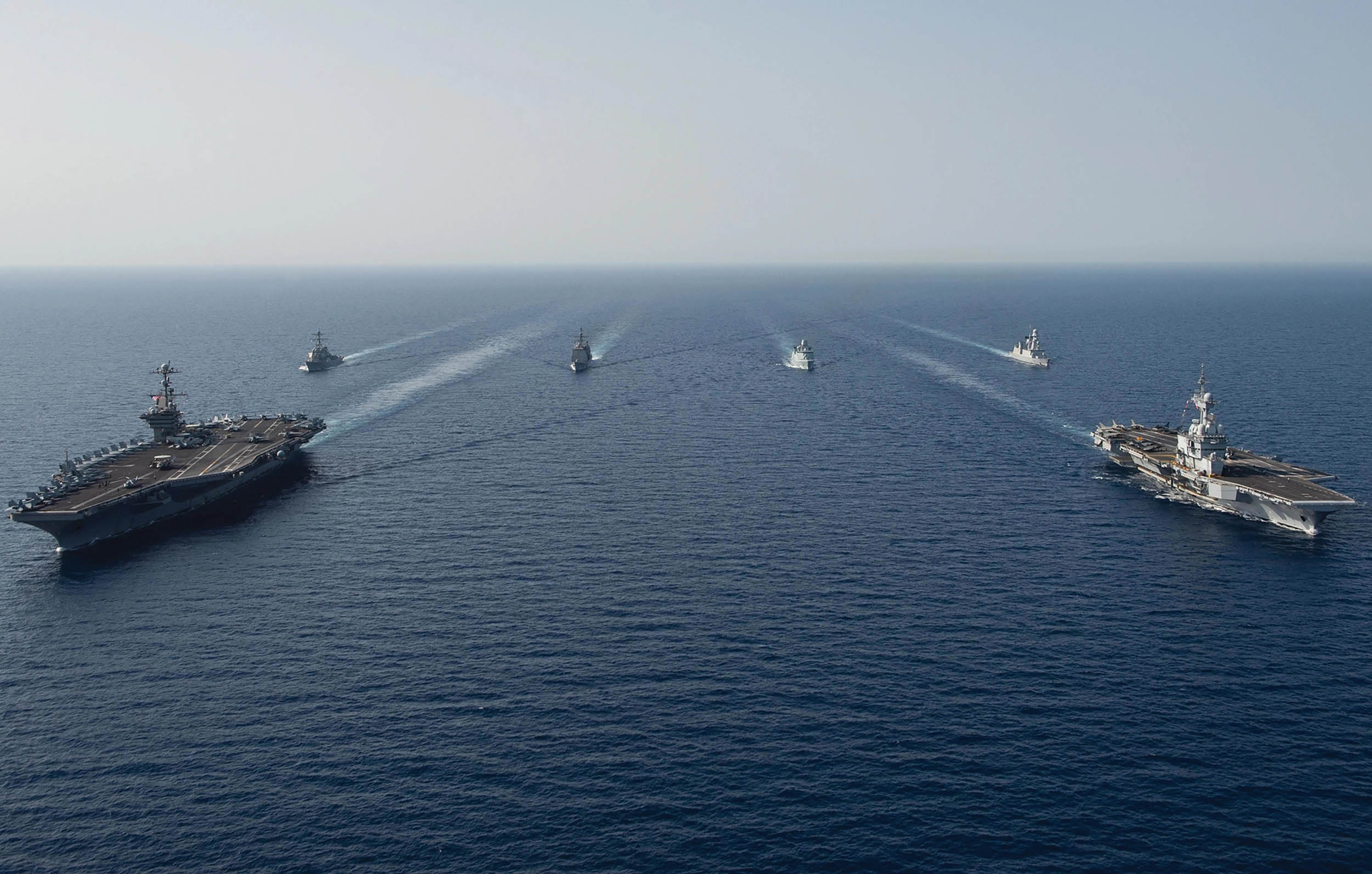 Aircraft carrier USS John C. Stennis, front left, French Marine Nationale aircraft carrier FS Charles de Gaulle, front right, guided-missile destroyer USS McFaul, guided-missile cruiser USS Mobile Bay, Royal Danish navy frigate HDMS Niels Juel, and French air defense destroyer FS Forbin transit in formation in Red Sea, April 15, 2019 (U.S. Navy/Skyler Okerman)