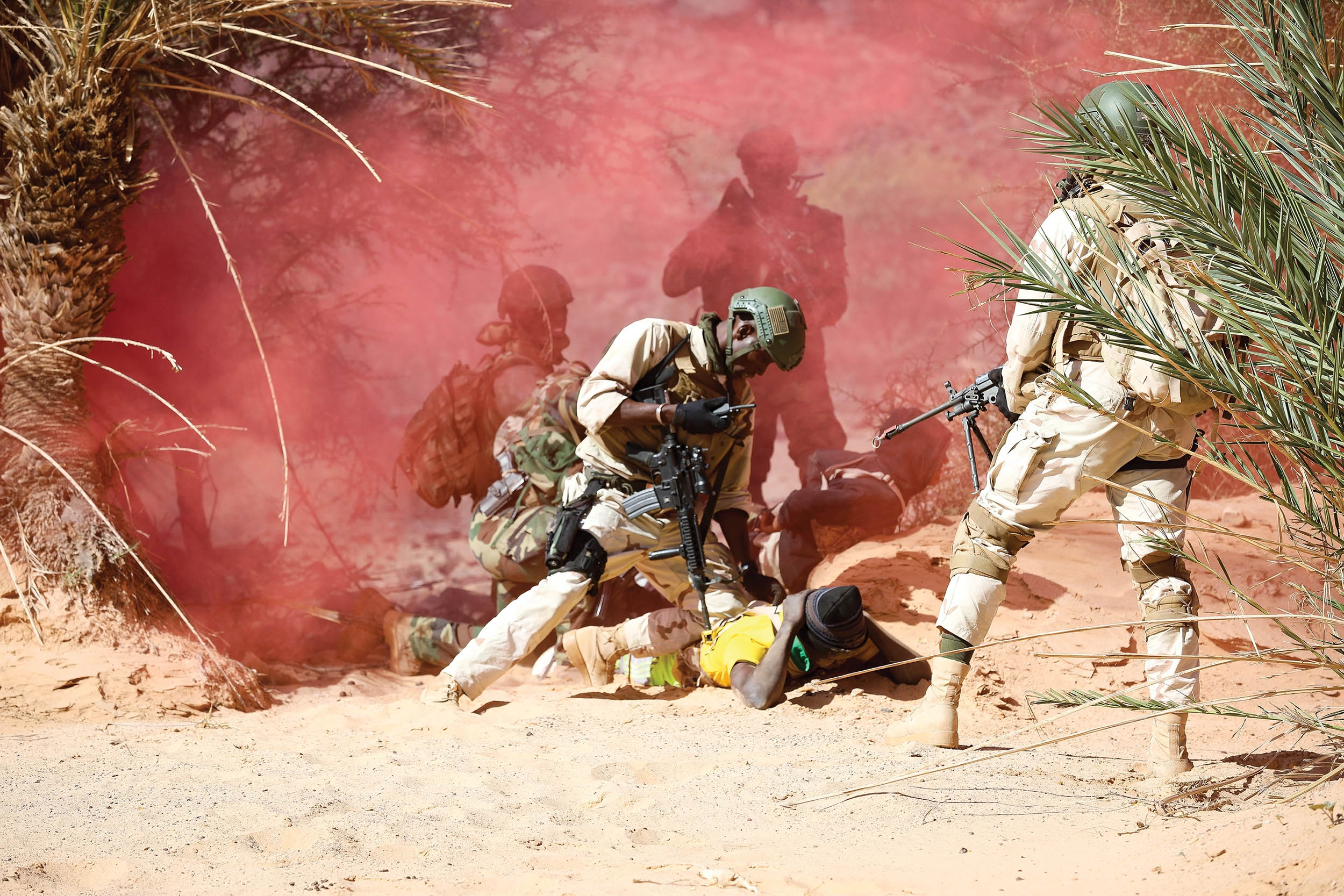 Senegalese soldier secures enemy combatant during simulated raid conducted after
gathering intelligence in pursuit of malign actors as part of Flintlock 20 scenario, near
Atar, Mauritania, on February 26, 2020 (U.S. Army/Conner Douglas)