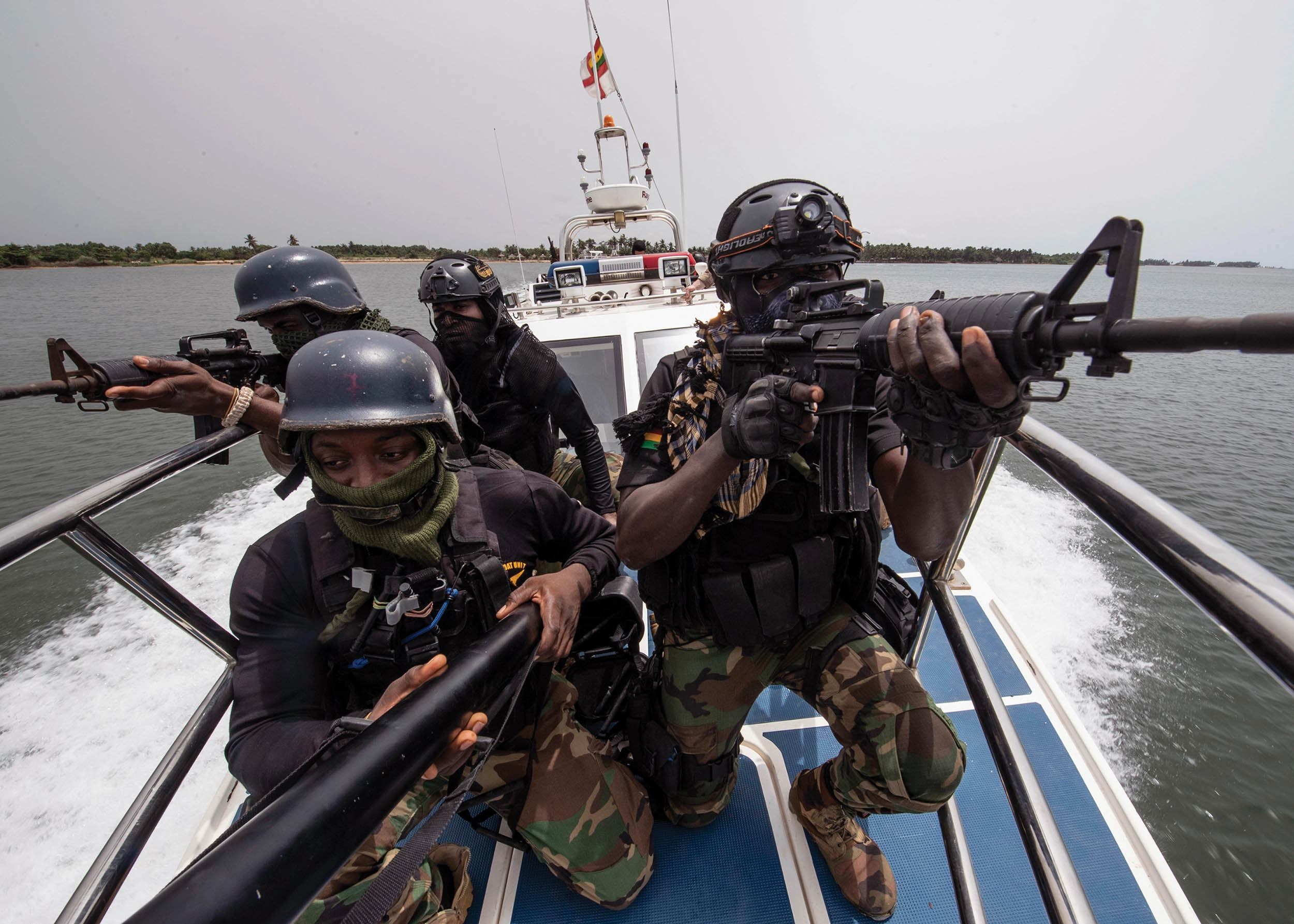 Ghanaian special forces provide cover while approaching vessel during boarding exercise as part of Obangame Express 2021, March 17, 2021,
near Nutekpo, Ghana (U.S. Navy/Fred Gray IV)