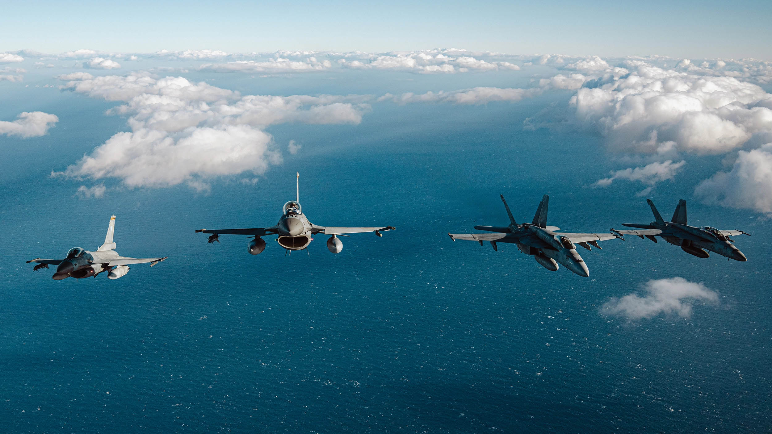 U.S. Navy F/A-18 Super Hornets and Greek F-16 Fighting Falcons conduct air-to-air training over Ionian Sea during Neptune Strike 2022, February 3, 2022 (U.S. Navy, courtesy French Armed Forces/Malaury Buis)