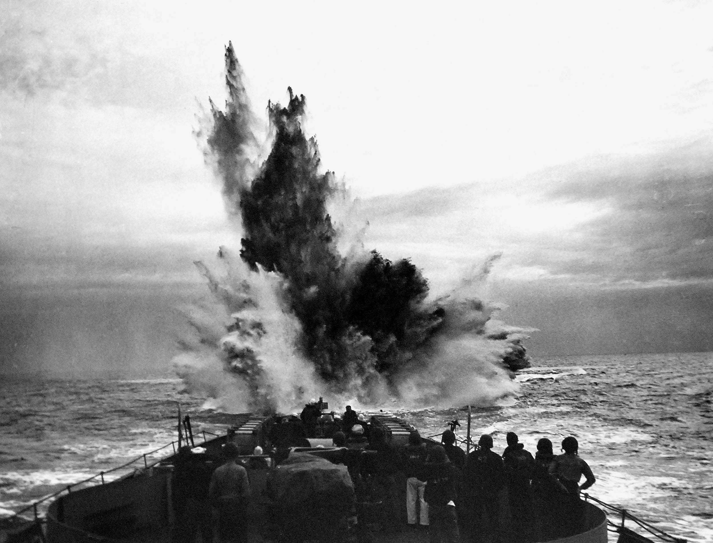 Coastguardsmen watch for possible depth charge explosion results during convoy patrol in Atlantic Ocean during World War II (National
Museum of the U.S. Navy)