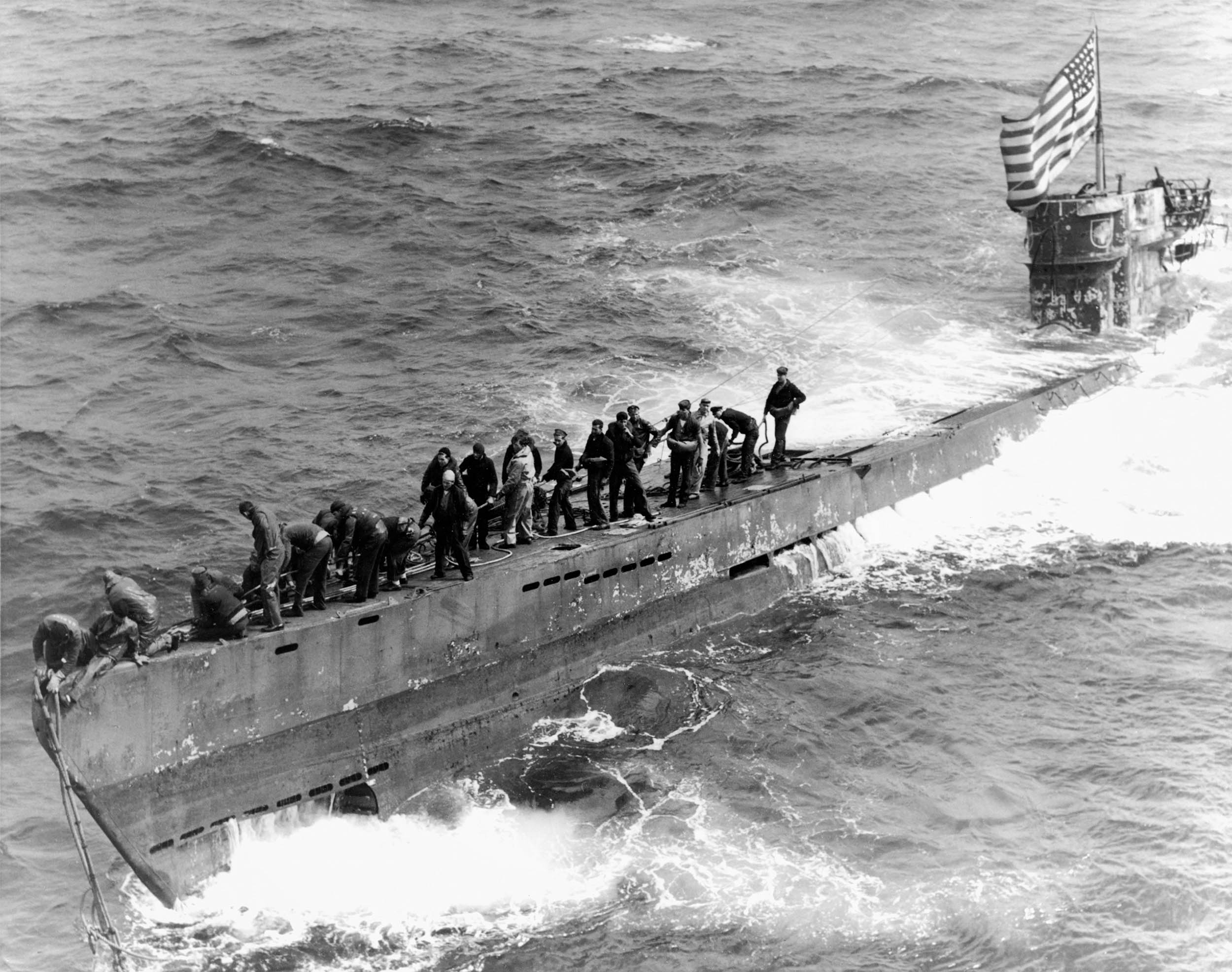Boarding party from Navy destroyer escort USS Pillsbury works to secure tow line to bow of captured German submarine U-505, June 4, 1944 (U.S. Navy/Naval History and Heritage Command)