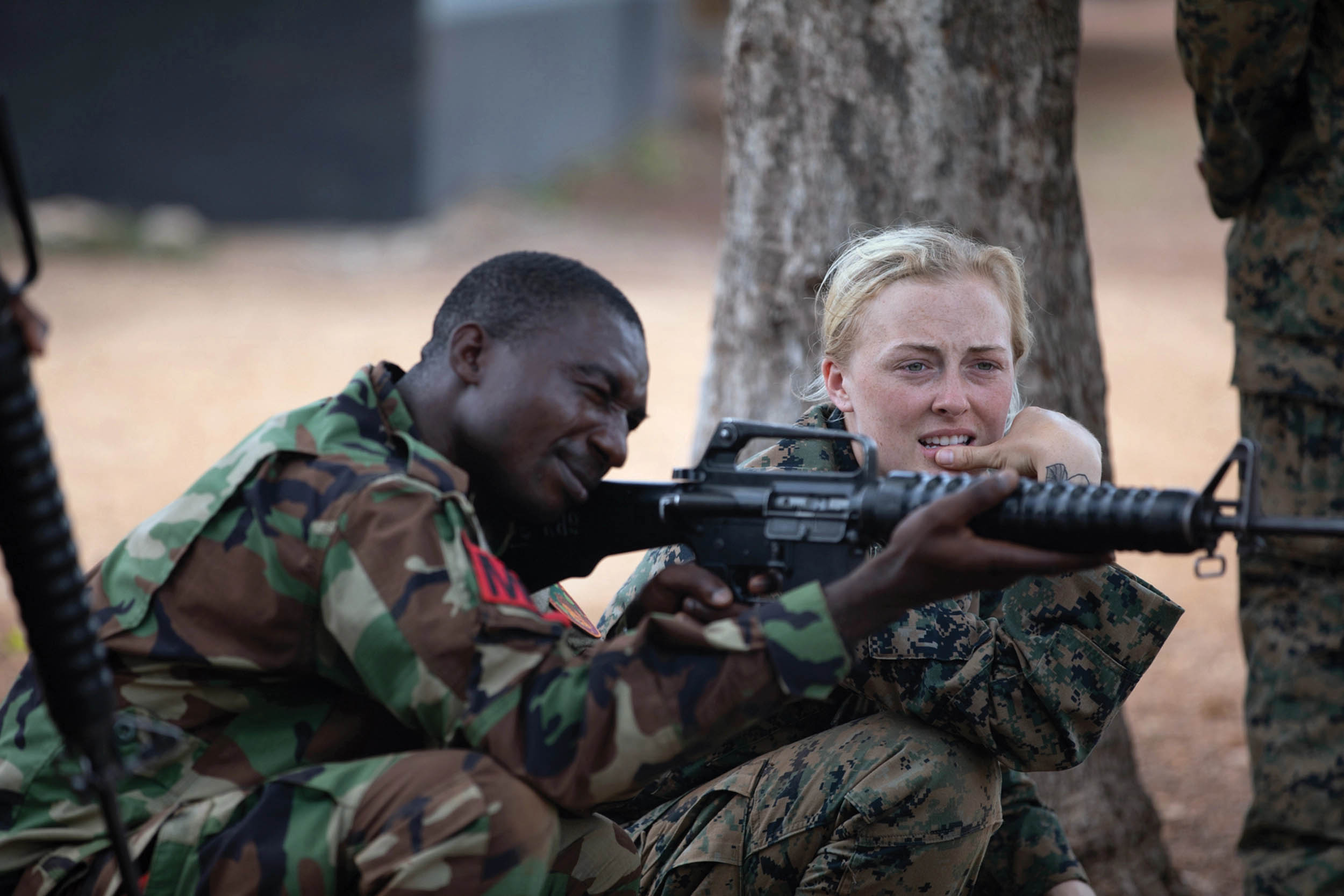 U.S. Marine Corps Sergeant Mercedes Klein trains with Ghanaian army soldier Sergeant Joseph Akataaba on marksmanship fundamentals during exercise African Lion, near Daboya, Ghana, June 7, 2023 (U.S. Army/Nathan Baker)