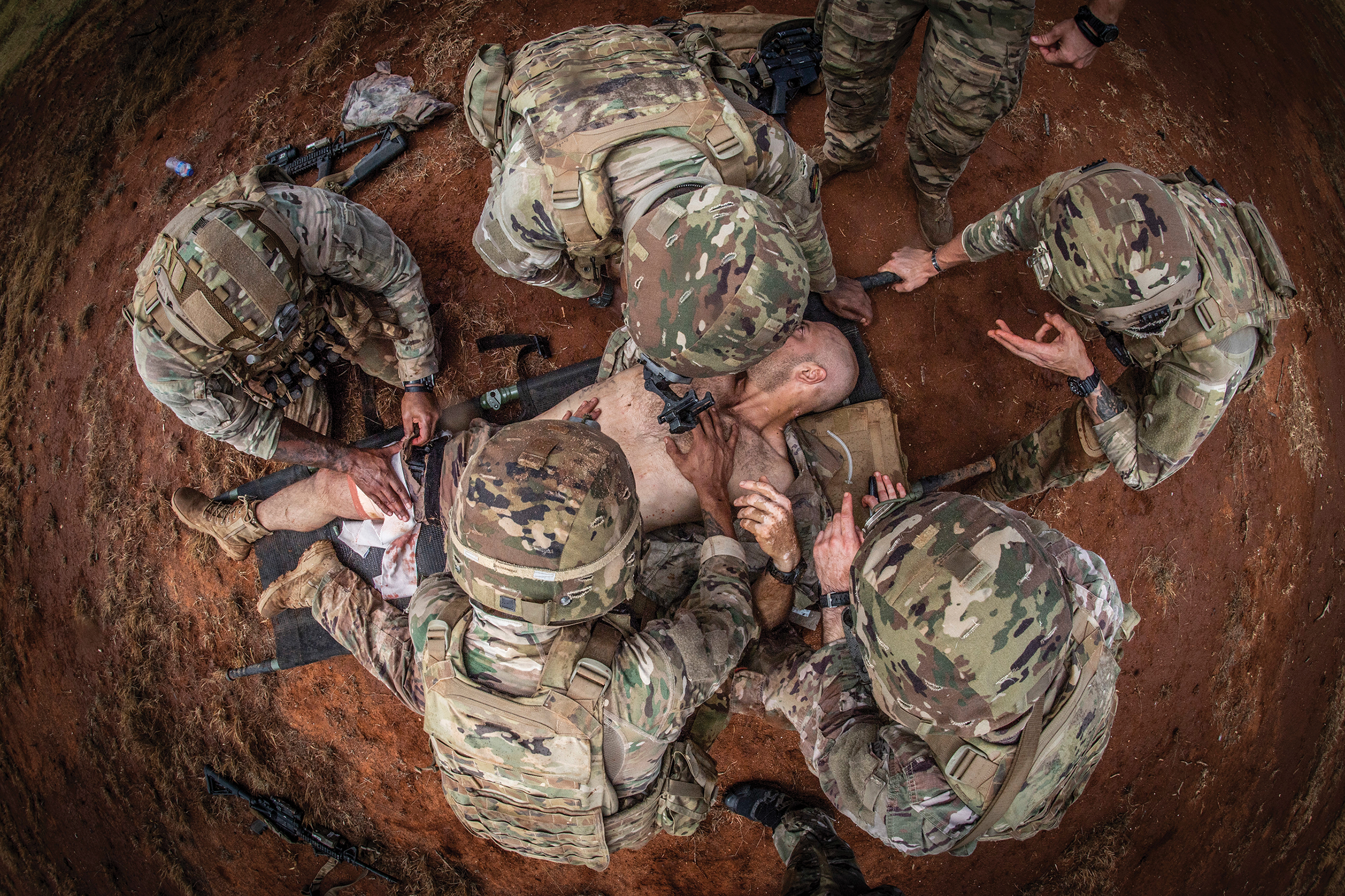 Special Amphibious Reconnaissance Corpsmen assigned to November Company, 3rd Raider Battalion, provide tactical combat casualty care training to Soldiers of 1st Battalion, 102nd Cavalry Regiment, during routine deployment to Somalia