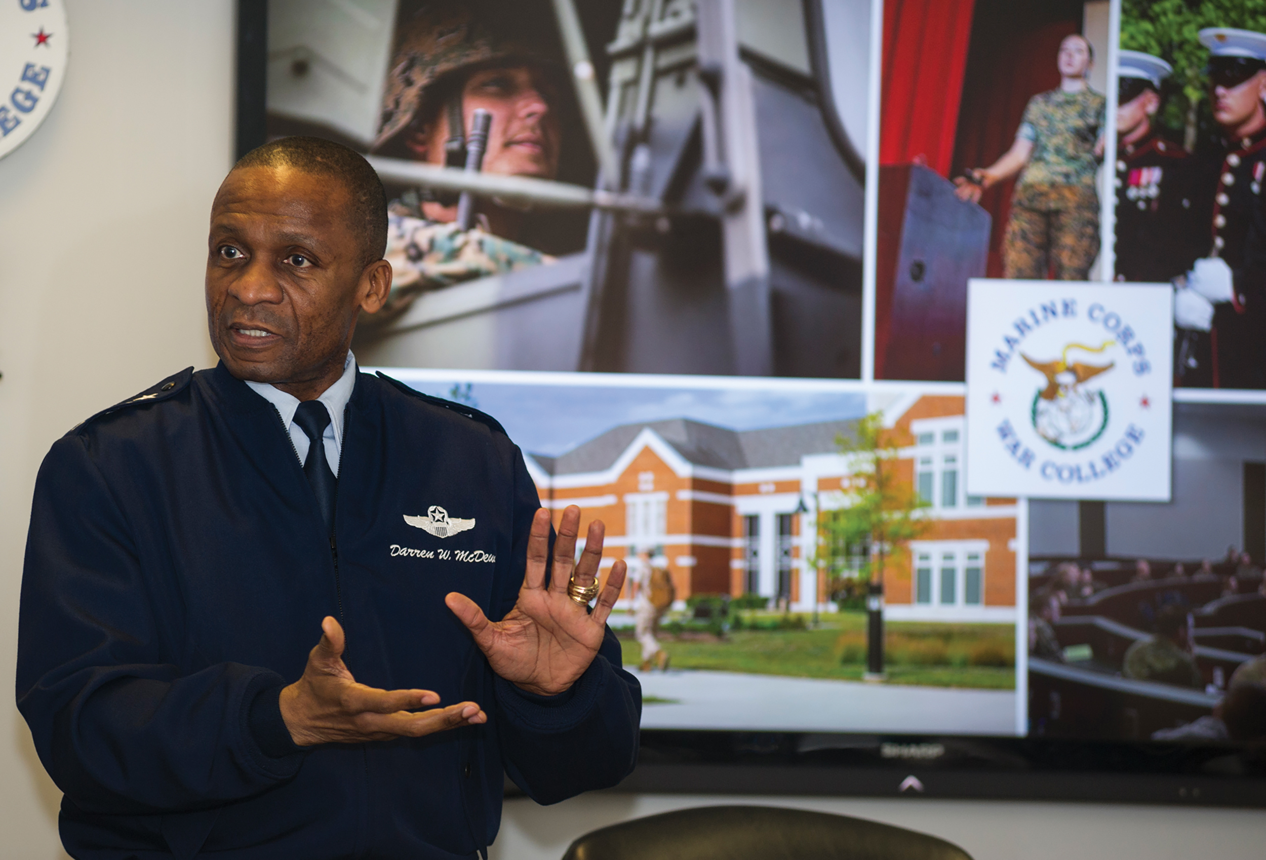 General Darren W. McDew, then commander of U.S. Transportation Command, Scott Air Force Base, Illinois, presents lecture to Marine Corps War College students at Dunlap Hall, Marine Corps University, Quantico, Virginia