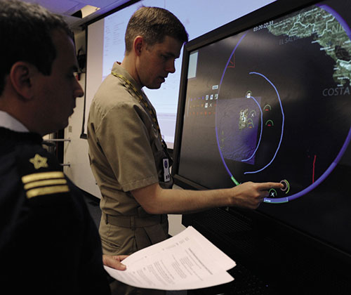 U.S. and Brazilian naval officers provide inputs to multitouch, multiuser interface during 2013 Inter-American War Game (U.S. Navy/James E. Foehl)