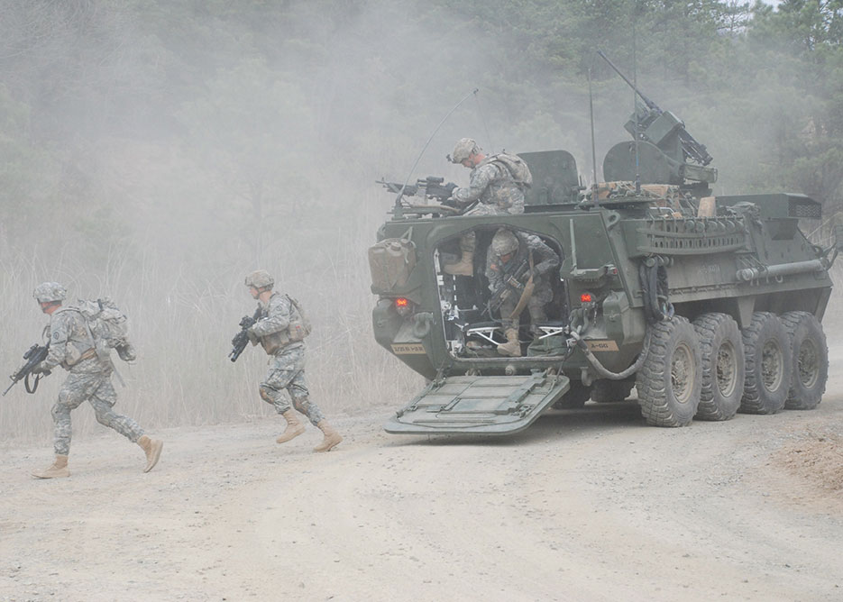 Soldiers dismount from Stryker vehicle during Foal Eagle 2012 as part of Combined Arms Live Fire Exercise at Rodriguez Range Complex, South Korea (U.S. Army)