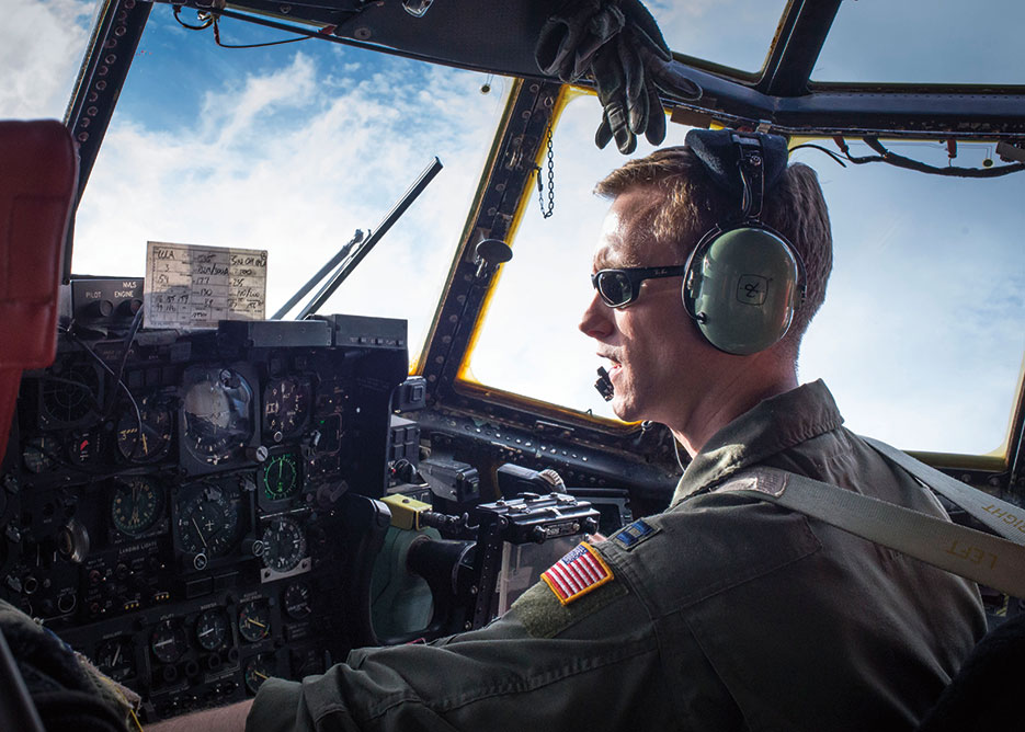 Thirty-sixth Airlift Squadron co-pilot flies C-130 Hercules during training mission as part of Readiness Week at Yokota Air Base, Japan, providing rapid tactical airlift support throughout Pacific theater (U.S. Air Force/Raymond Geoffroy)