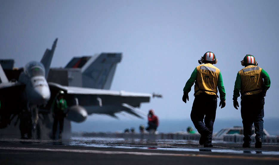 Sailors inspect catapult before launching F/A-18F Super Hornet from Nimitz-class aircraft carrier USS Carl Vinson, deployed supporting maritime security operations and theater security cooperation efforts in U.S. 5th Fleet area of responsibility (U.S. Navy/Travis K. Mendoza)