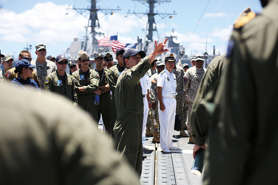 Pilots from the United States and other nations attend flight deck familiarization tour while onboard U.S. Navy Oliver Hazard Perry–class frigate USS Gary as part of Rim of the Pacific Exercise 2014 (Royal Australian Navy/Chantell Bianchi)