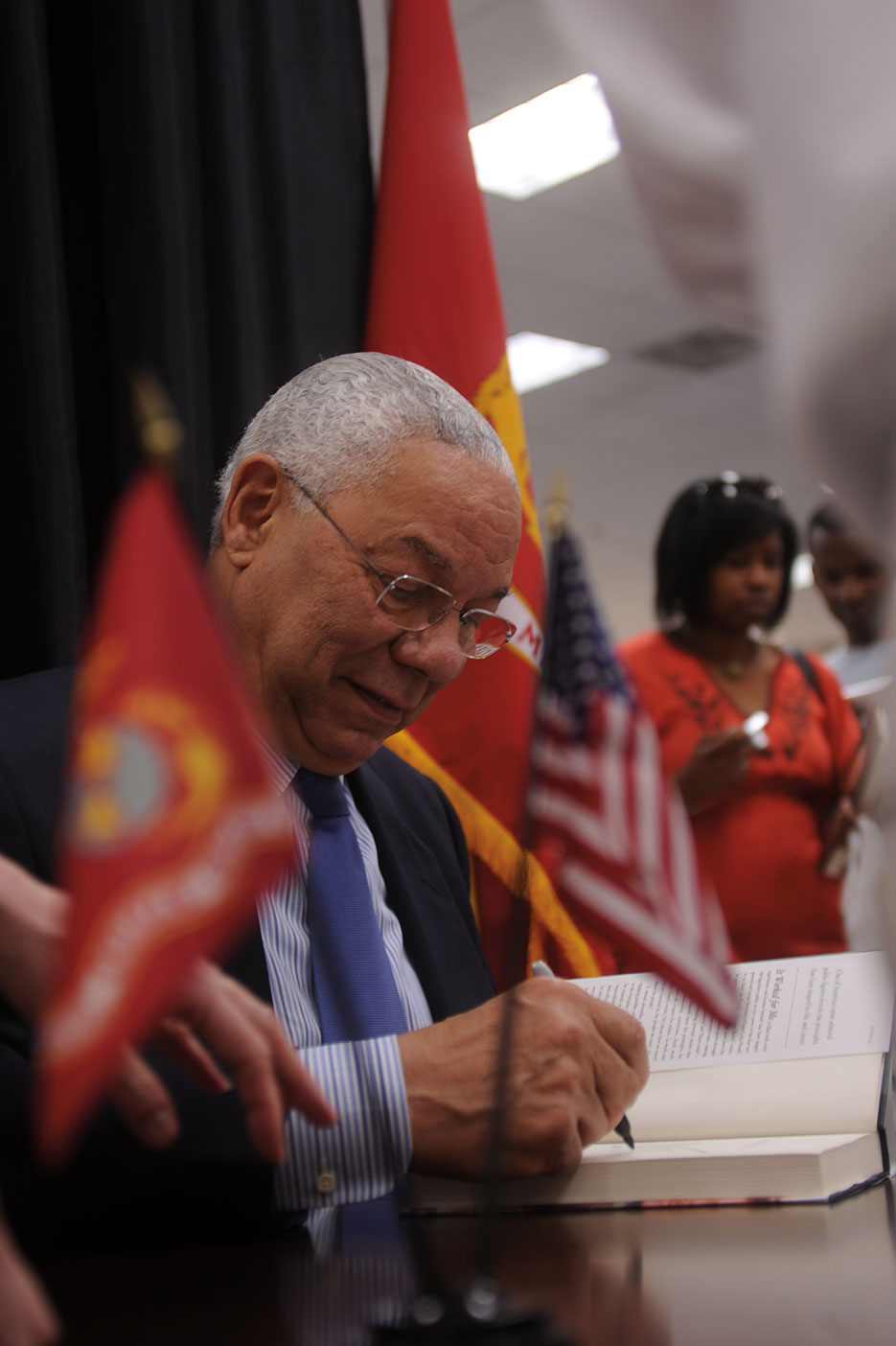 Retired Army General Colin Powell signs books at Marine Corps Exchange aboard Marine Corps Base Quantico in June 2013 (U.S. Marine Corps/Sam Ellis)