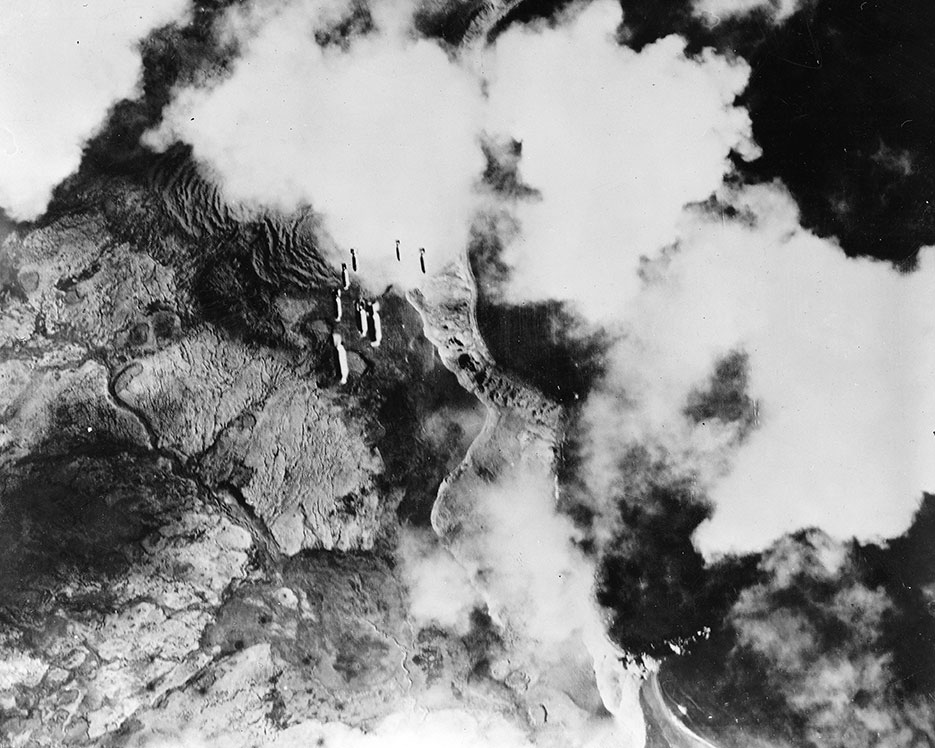 Bombs dropping in train from U.S. Army Air Force plane on Kiska, Aleutian Islands (Library of Congress, Prints & Photographs Division, FSA/OWI Collection)