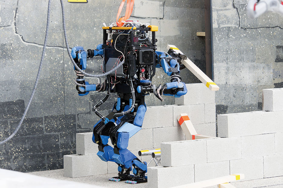 Team SCHAFT’s robot, S-One, clears debris at DARPA’s Robotics Challenge trials (DARPA/Raymond Sheh)